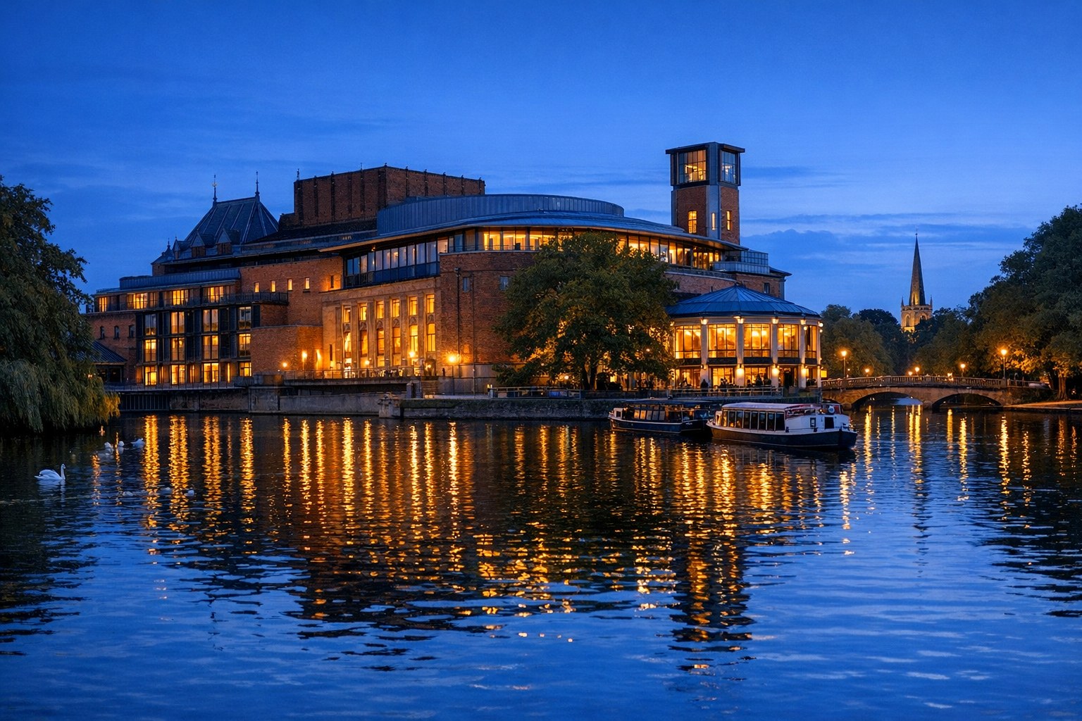 Riverside theatre glowing at blue hour