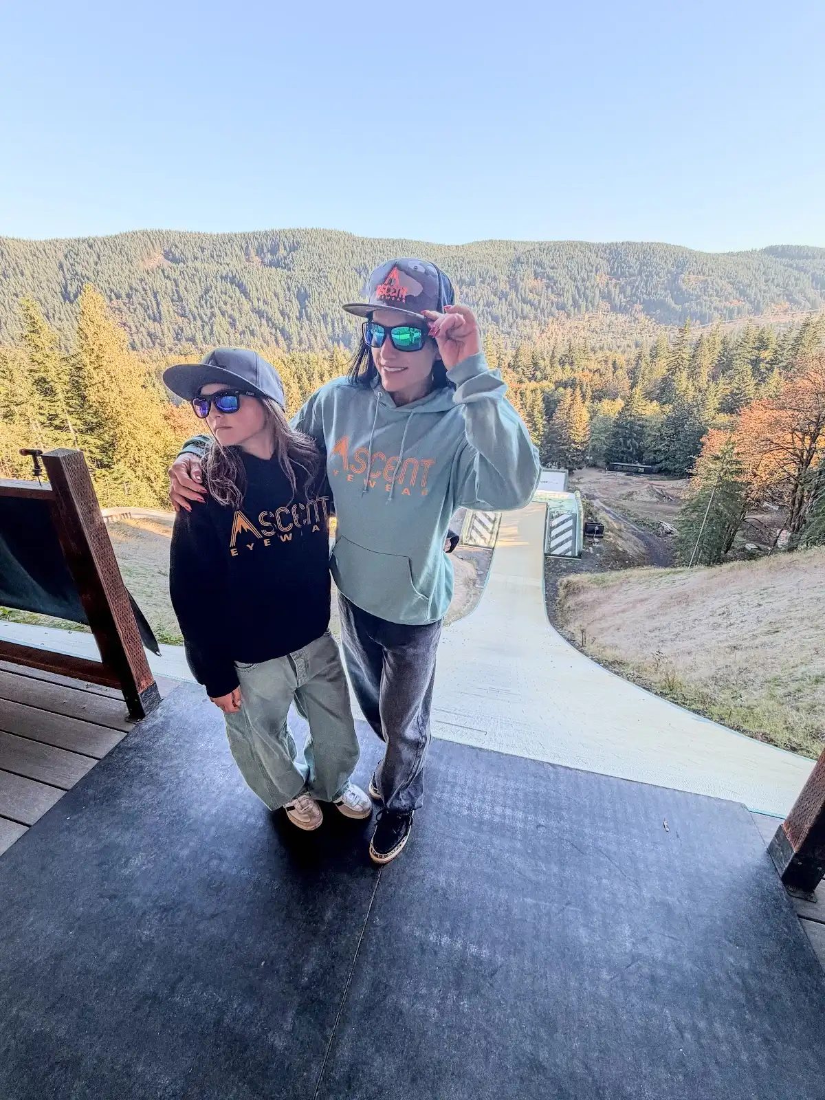 Two riders above a mountain training ramp