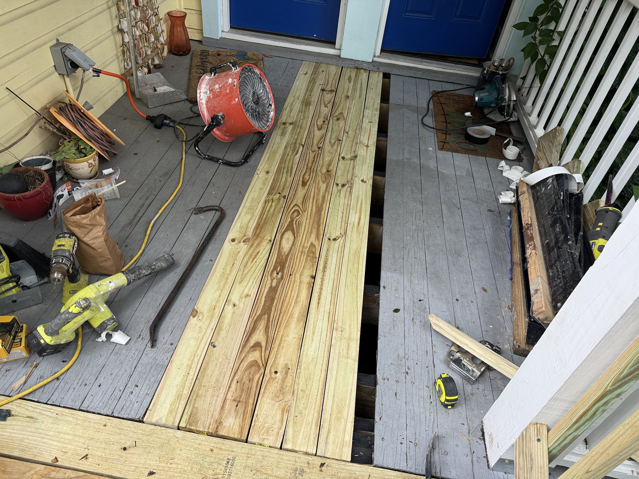 New porch deck boards being installed during the St. Augustine restoration