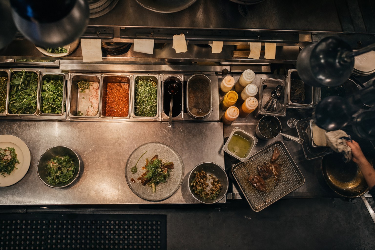 Overhead view of a working restaurant prep station