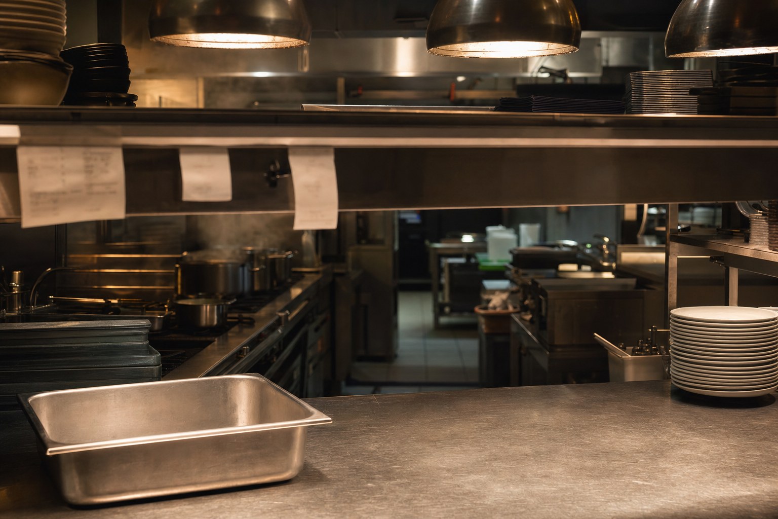 Restaurant pass with an empty prep pan during dinner service