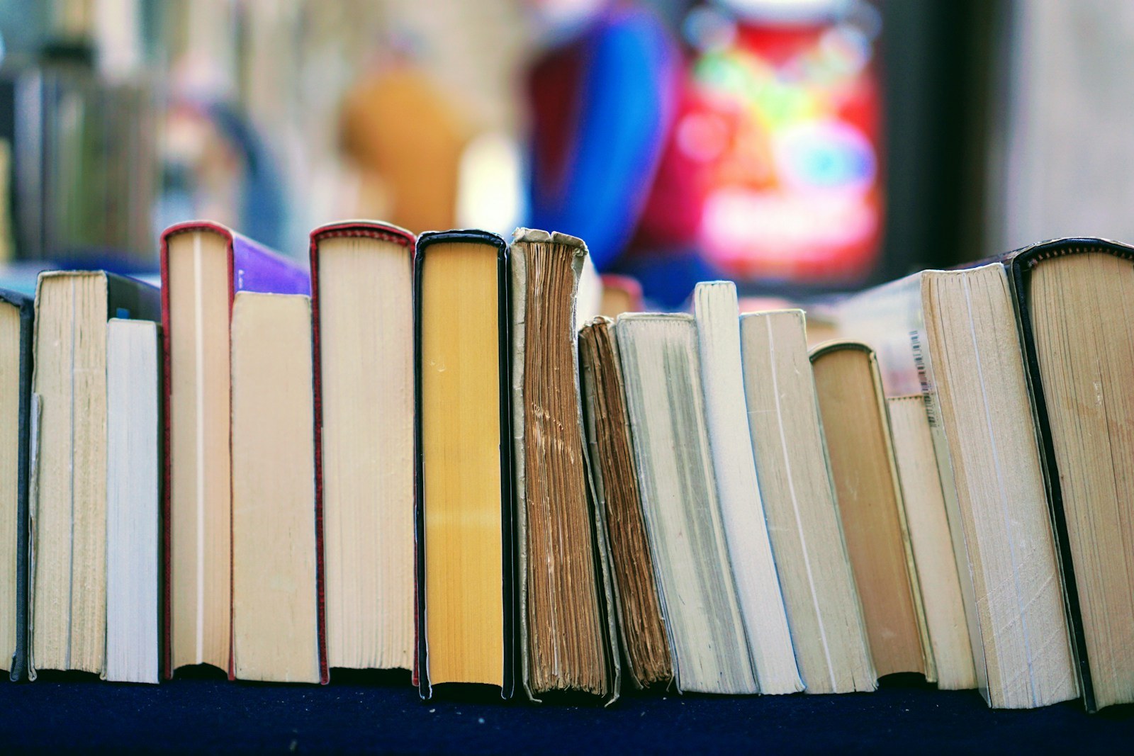 Row of well-used academic books in a library