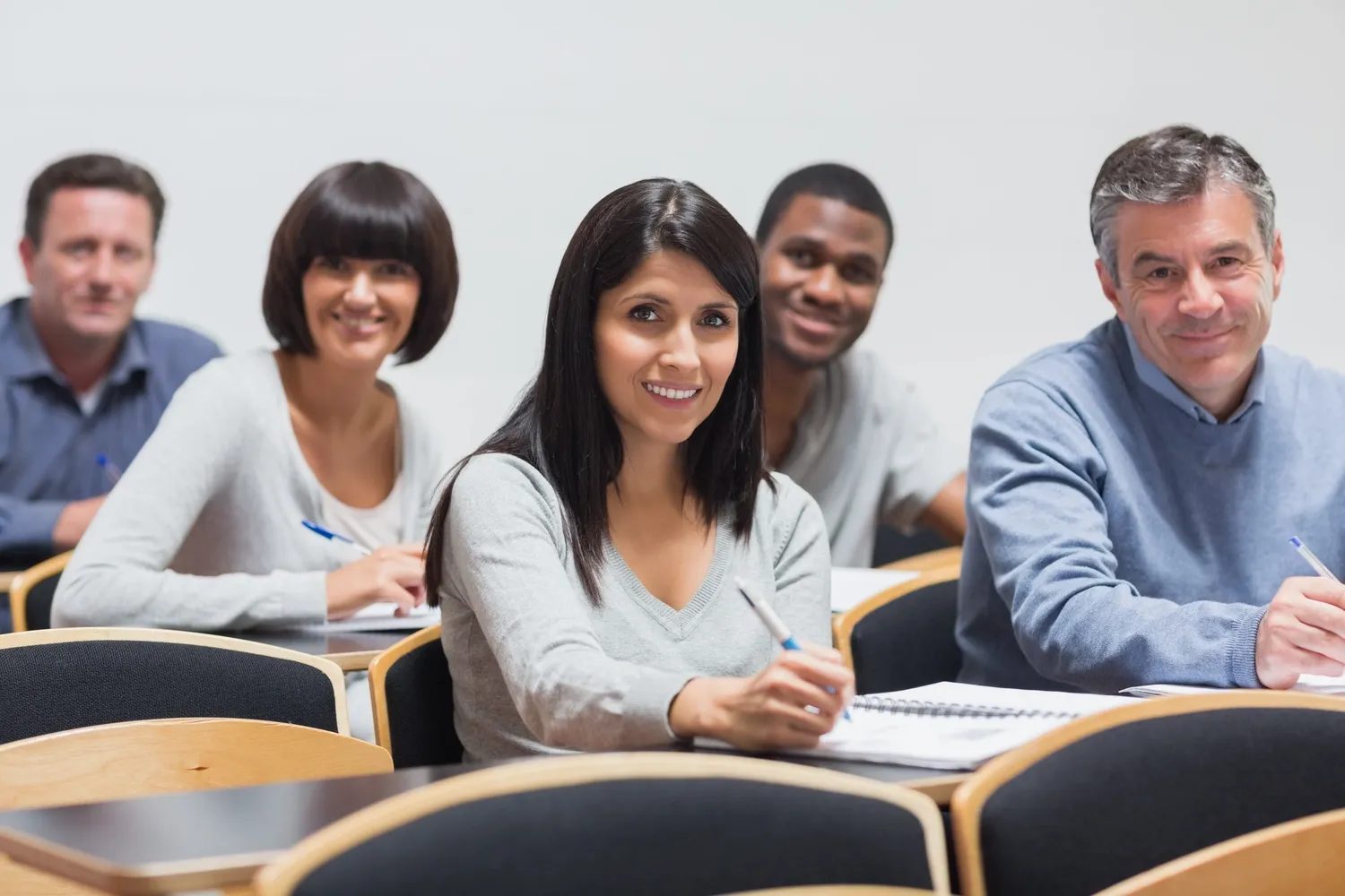 Adult learners seated together in a classroom