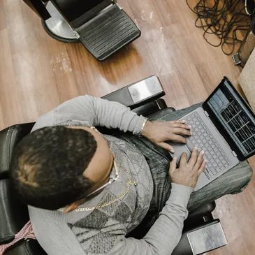A learner working on a laptop