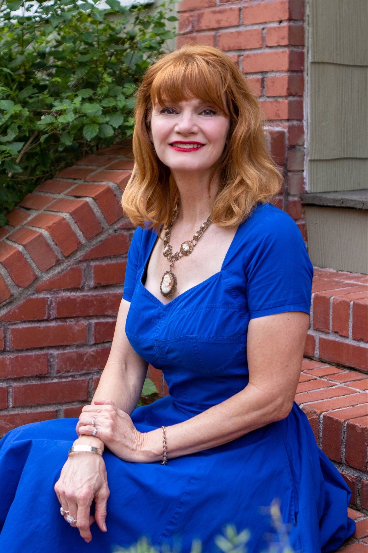 Wendy Molinaroli seated outdoors