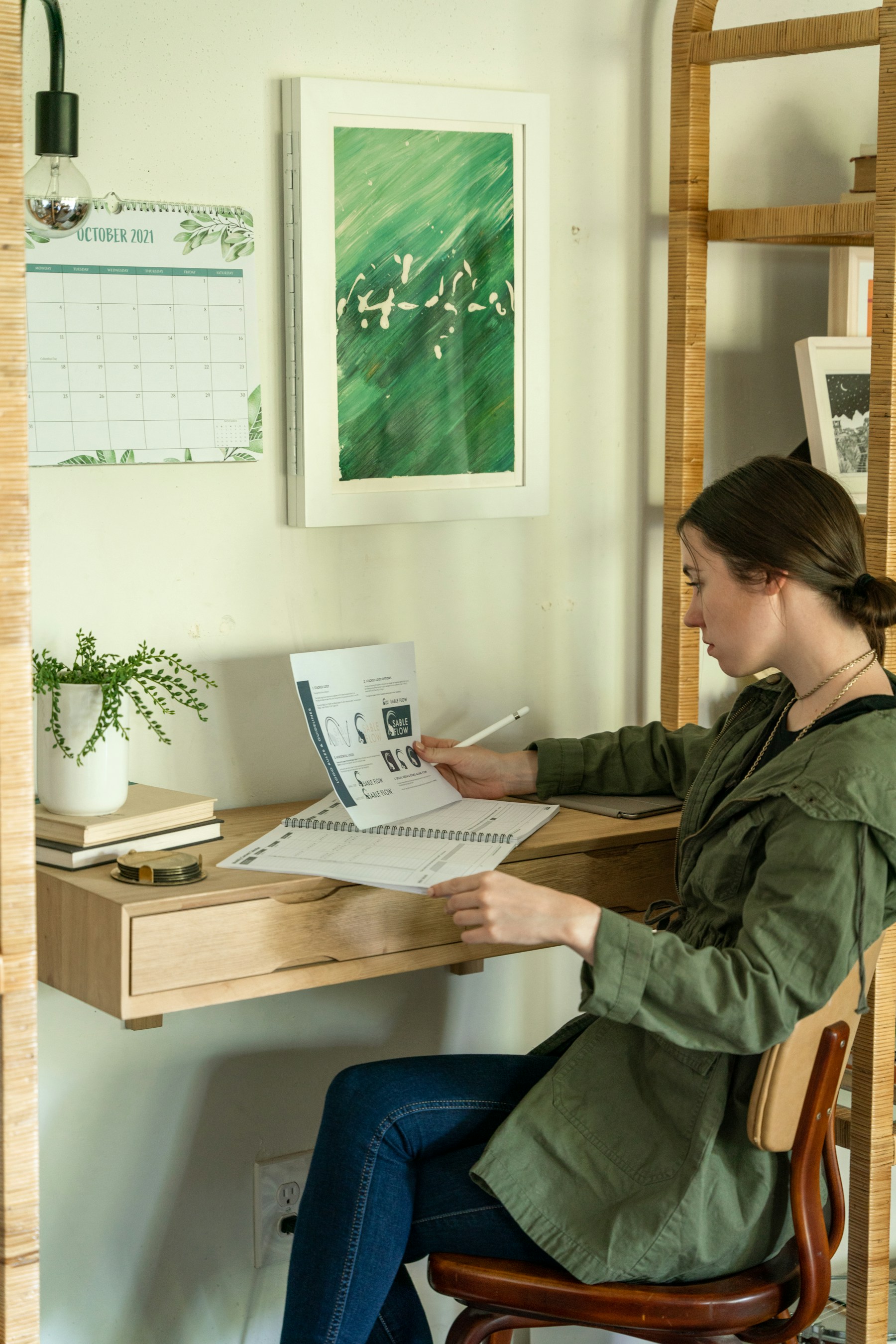 Person reviewing notes at a home desk before a virtual appointment