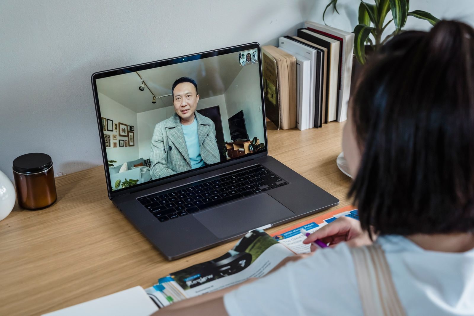 Person taking notes during a private video visit