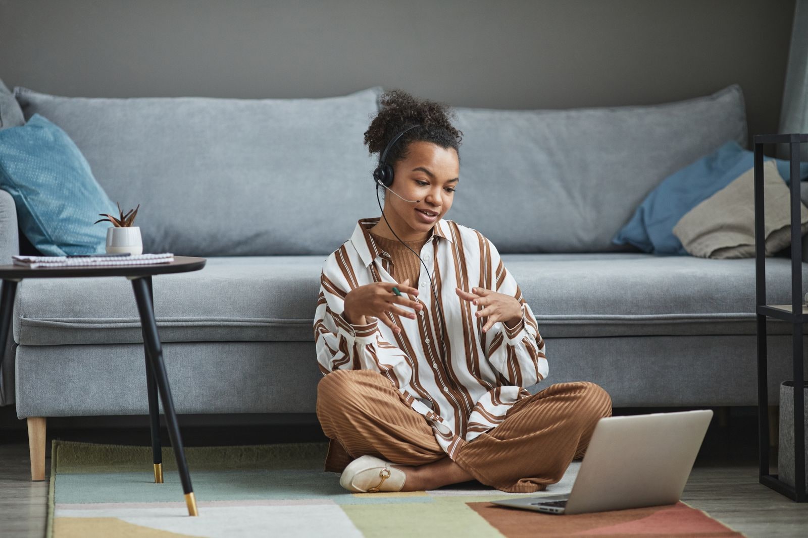 Person speaking from a comfortable home setting during a video call