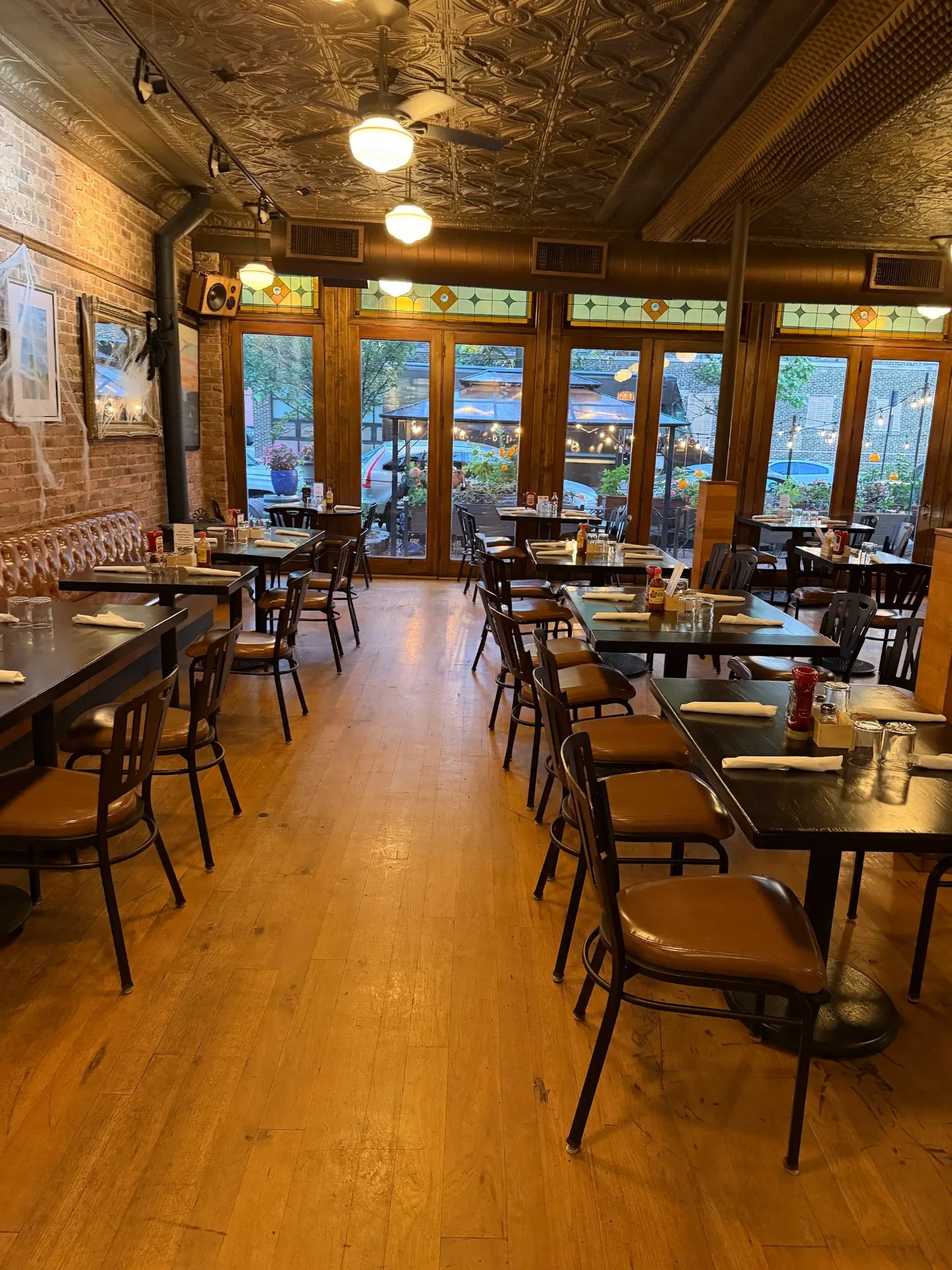 Warmly lit dining room at Port & Park in Lakeview Chicago