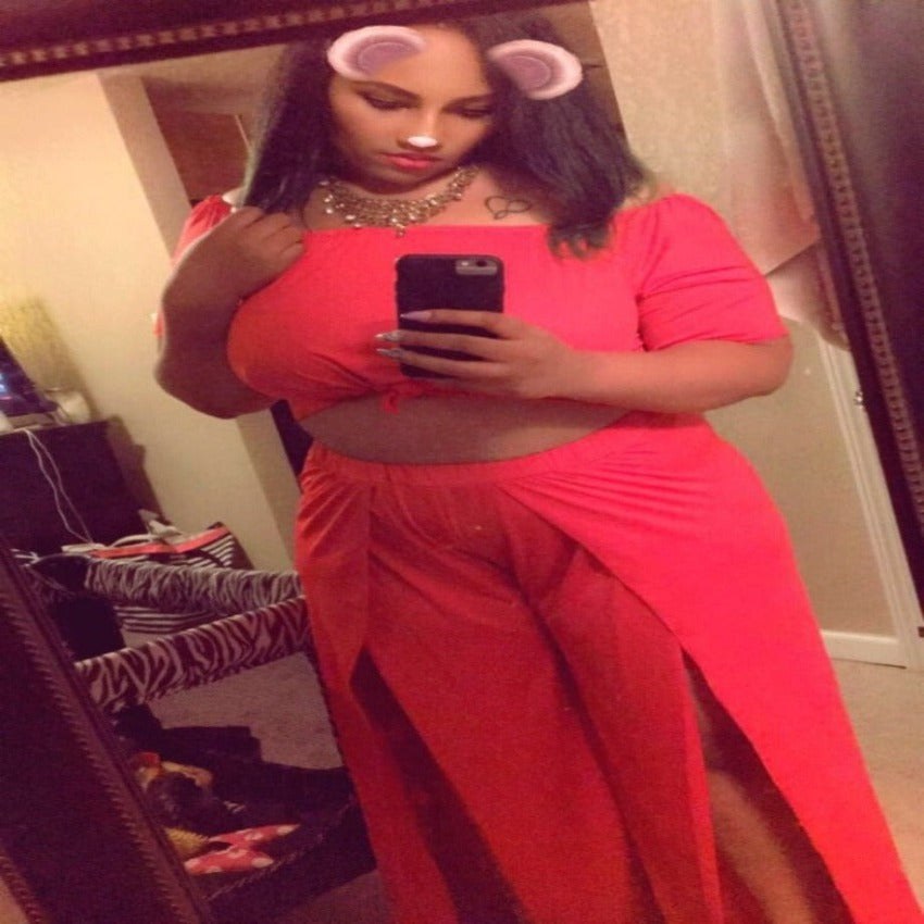Coral off-the-shoulder top and wide-leg pants set for a birthday celebration