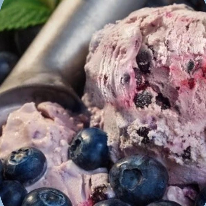A pink scoop of custard with berry ribbon