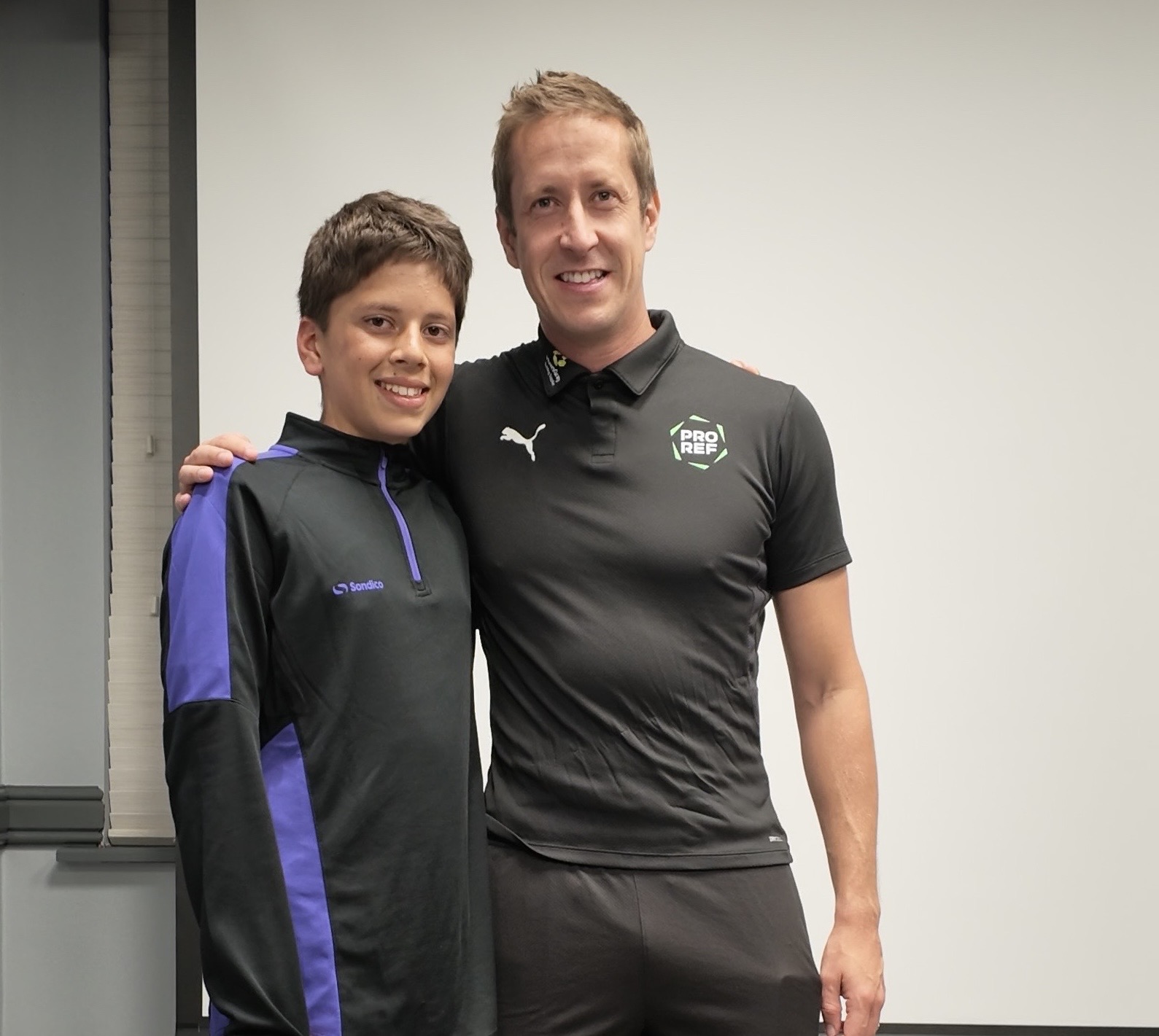 Premier League referee John Brooks with an Iconz Experience player