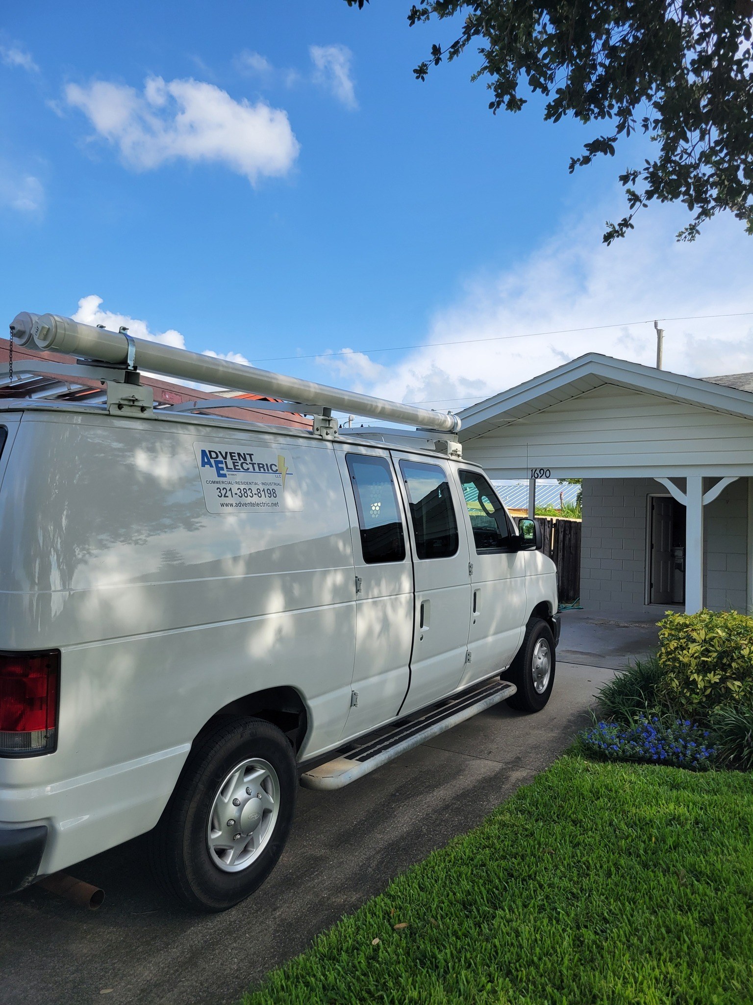 Advent Electric branded service van at a home
