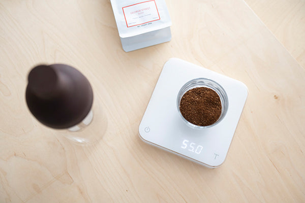 Coarse coffee grounds measured in a glass cold brew brewer