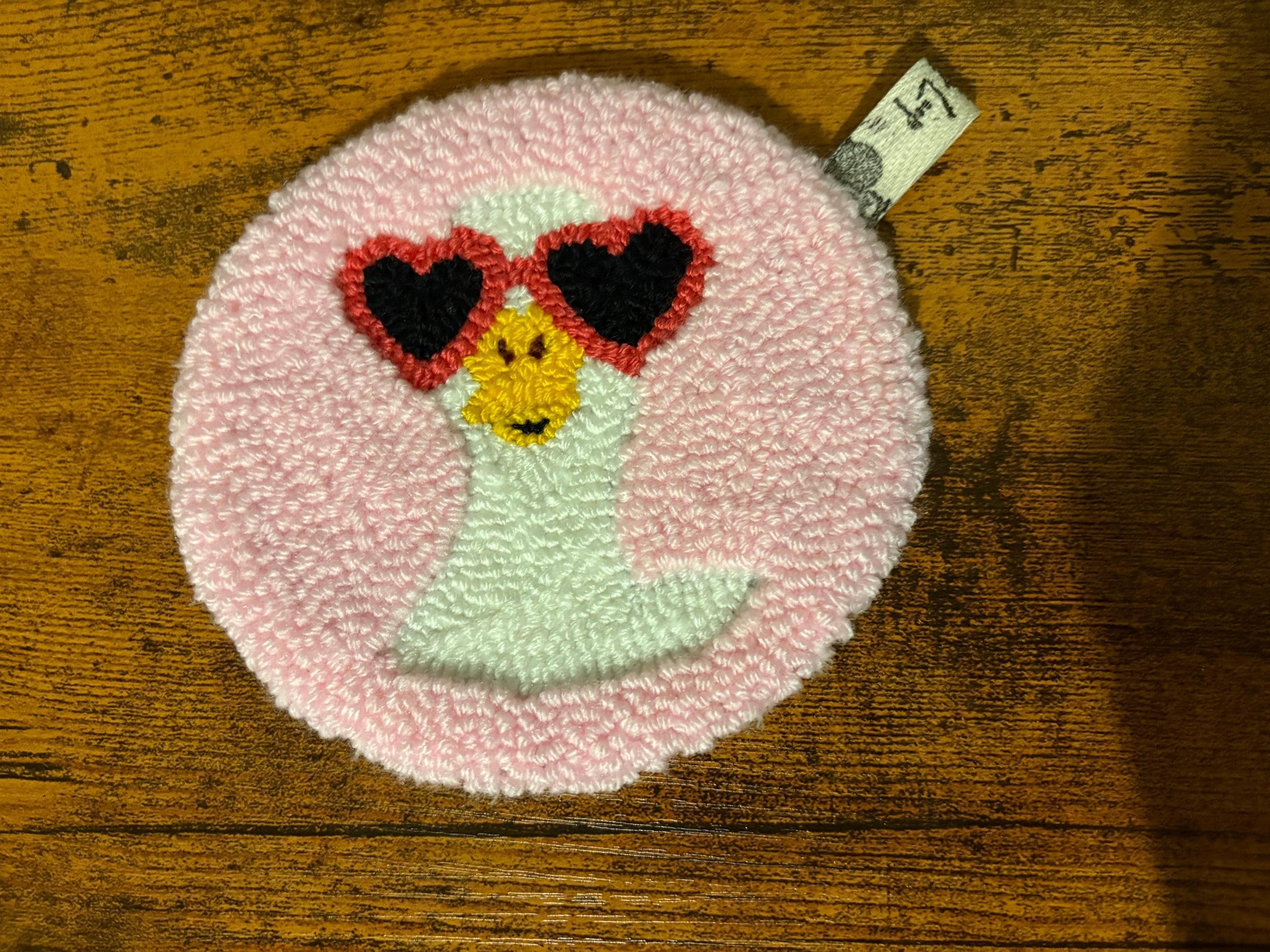 Pink goose punch needle coaster with heart sunglasses