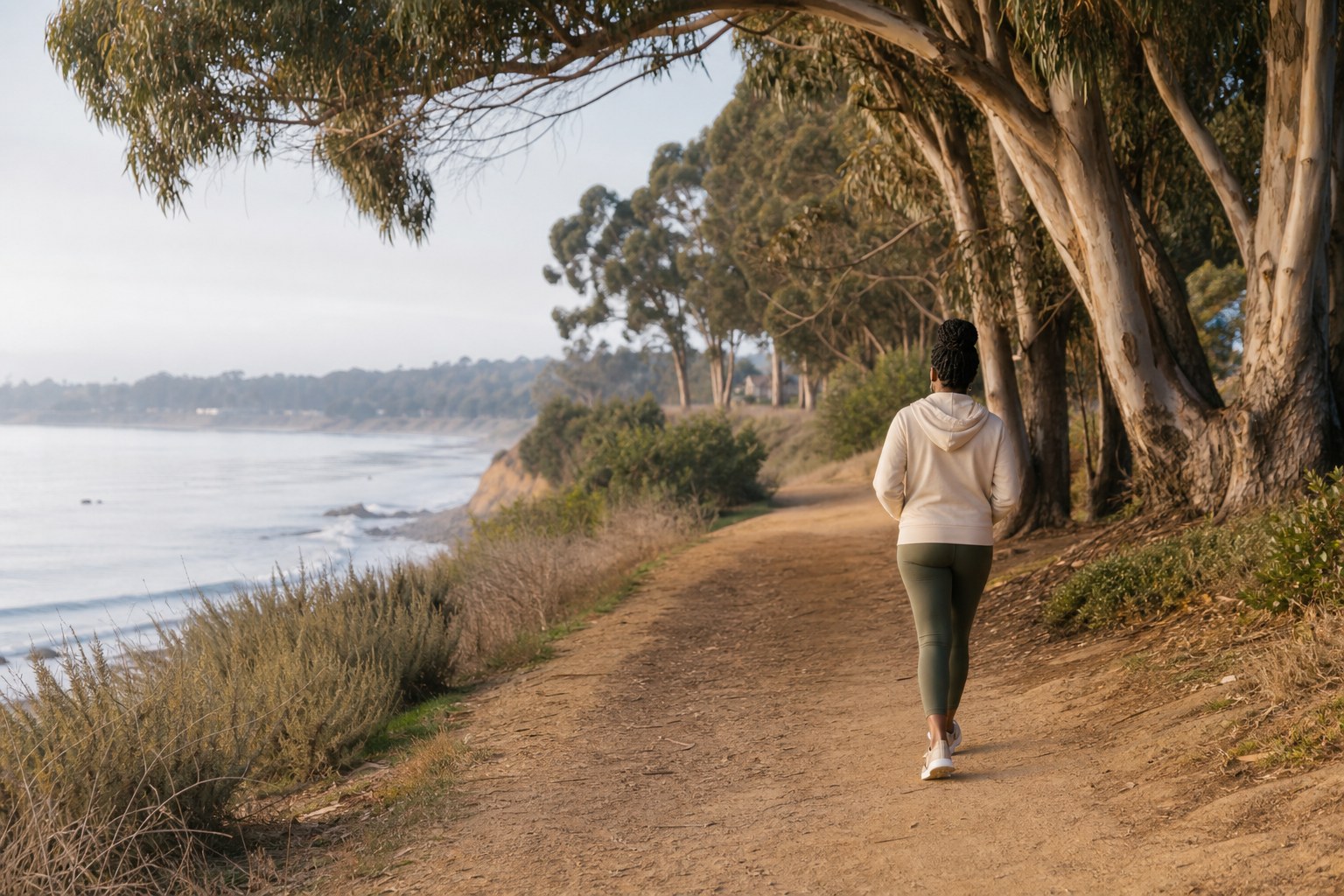 Woman taking a quiet walk beside the California coast