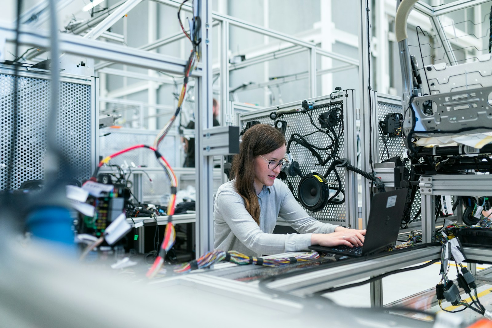 Engineer working inside a modern manufacturing facility
