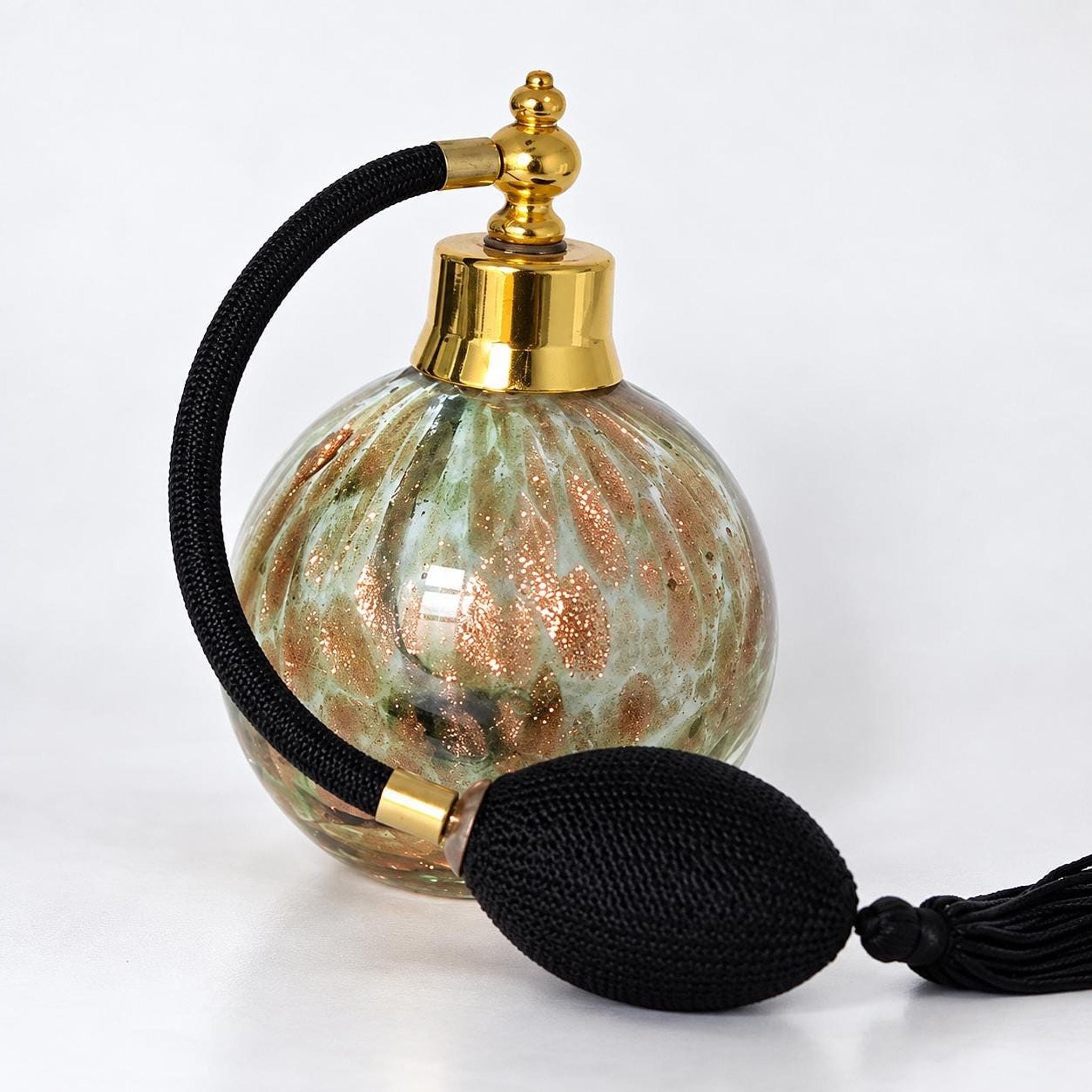 Green glass perfume atomizer with copper-gold decoration and tassel