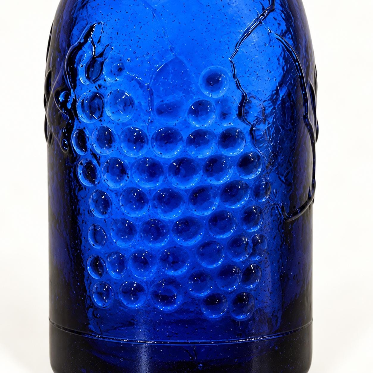 Vintage Cobalt Blue Textured Glass Bottle | Embossed Grapes & Leaves | 12” Decorative Art Glass Bottle, view 4
