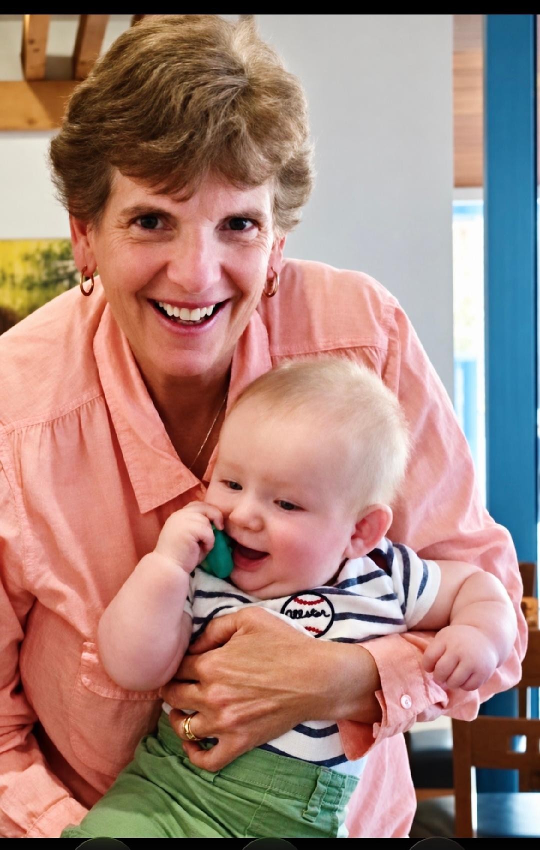 Christine holding a baby