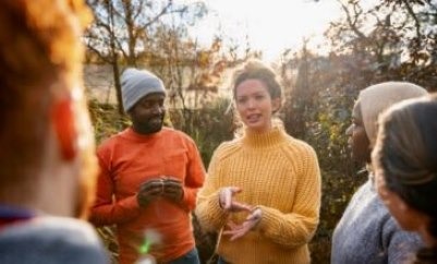 People gathered outdoors in conversation