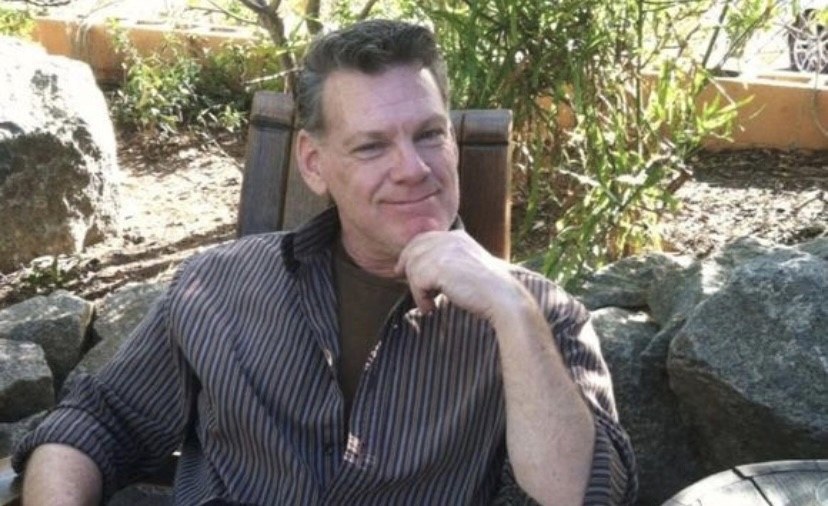 Brother Kevin seated outside
