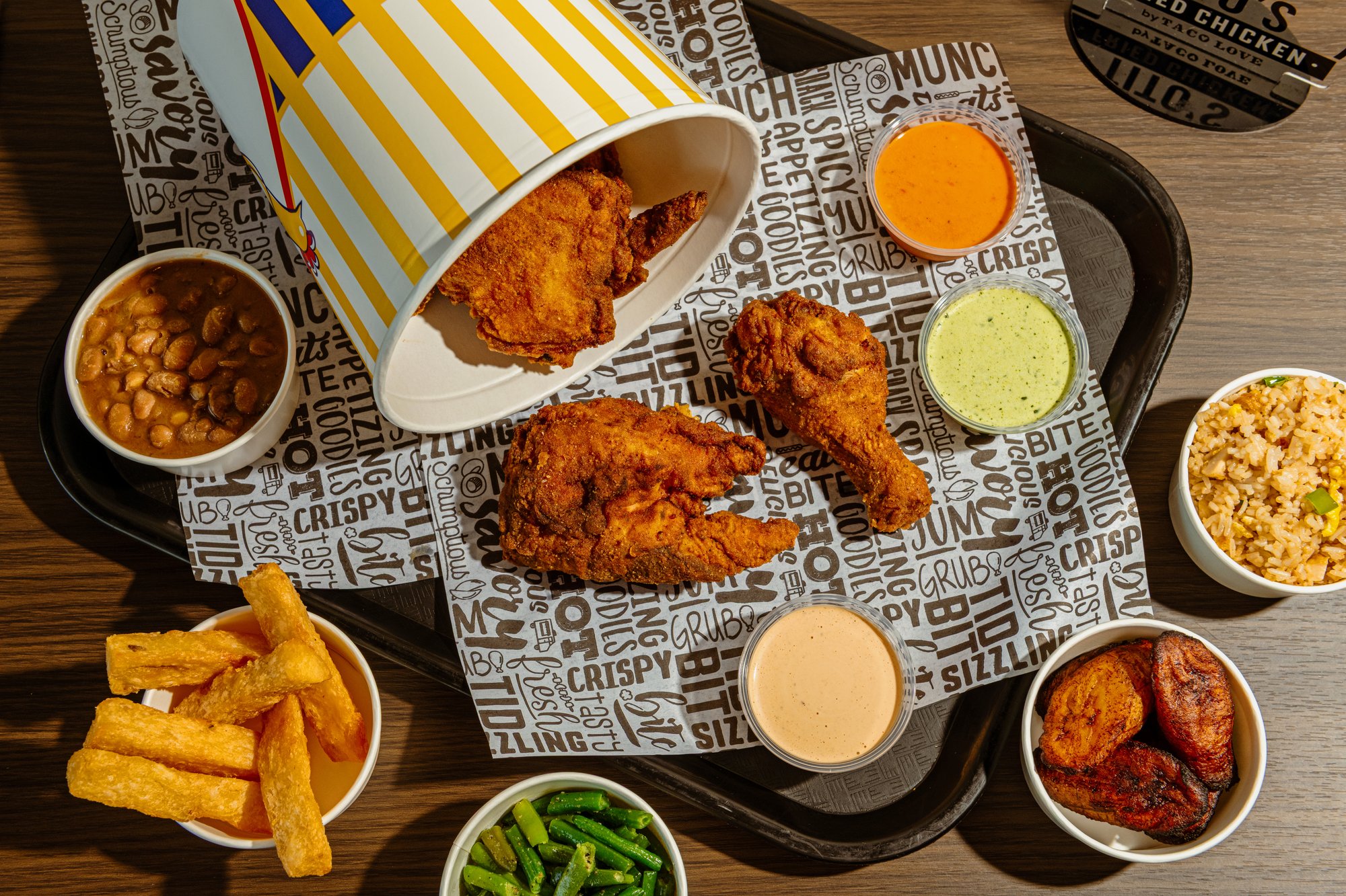 Fried chicken, fries, sides, and sauces ready to share