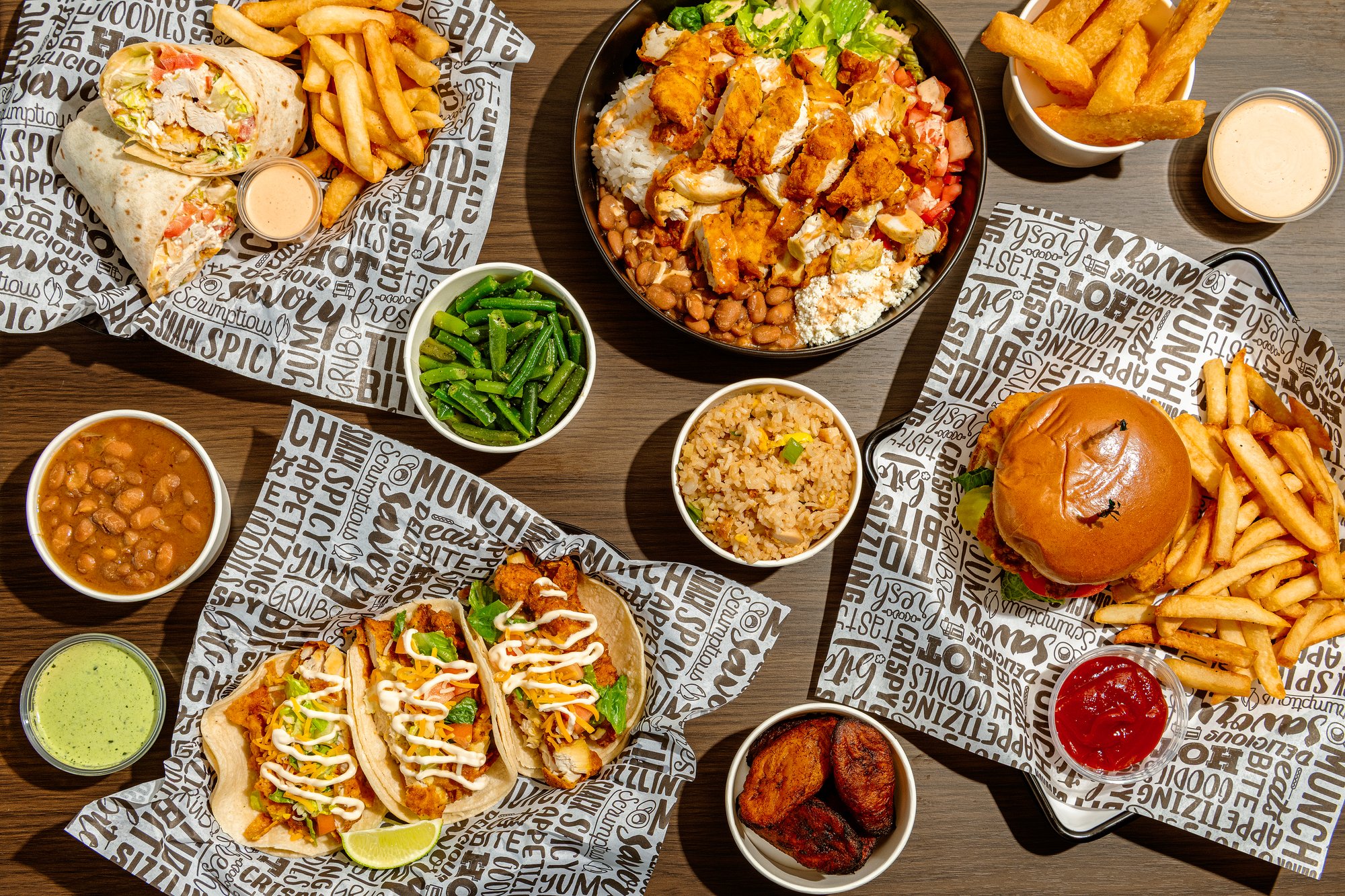 A full Tito’s spread with fried chicken, tacos, sides, and sauces
