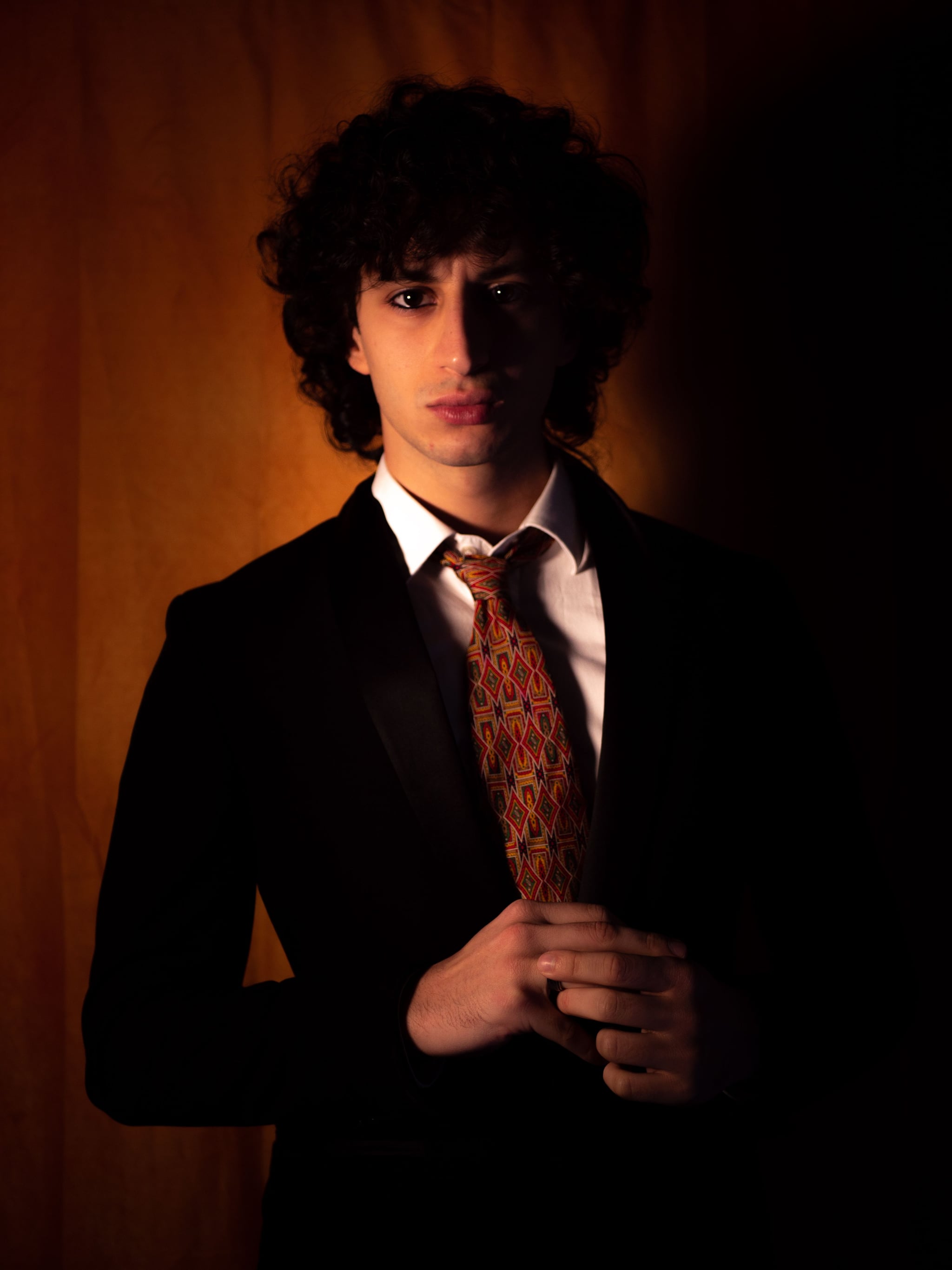 Man in a tailored suit and tie