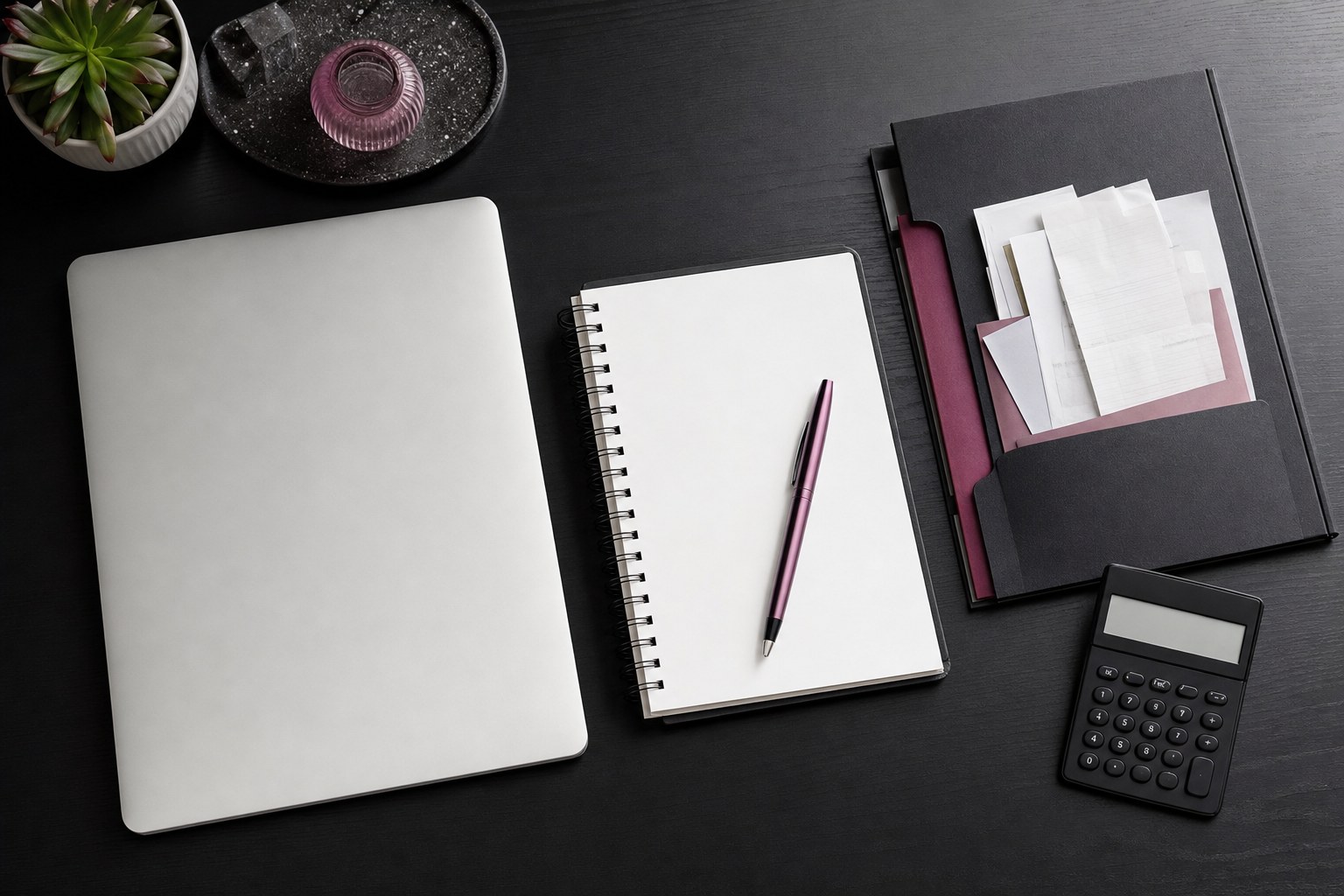 Notebook, calculator, and organised folder representing financial readiness