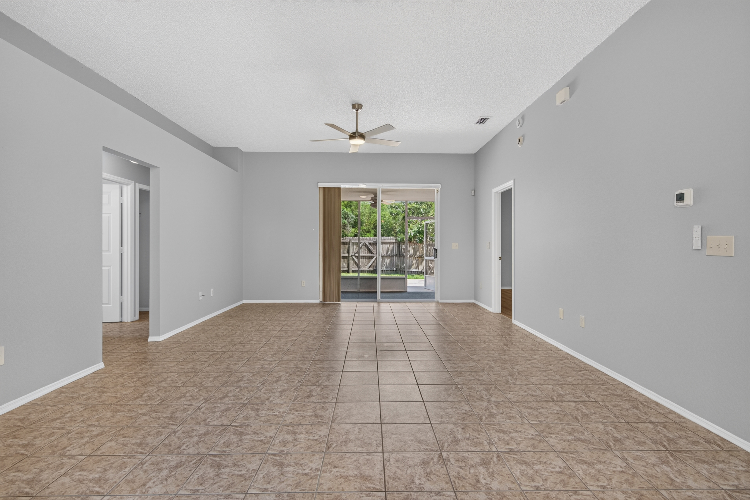Open living area with patio access at 1053 Sugarberry Trail