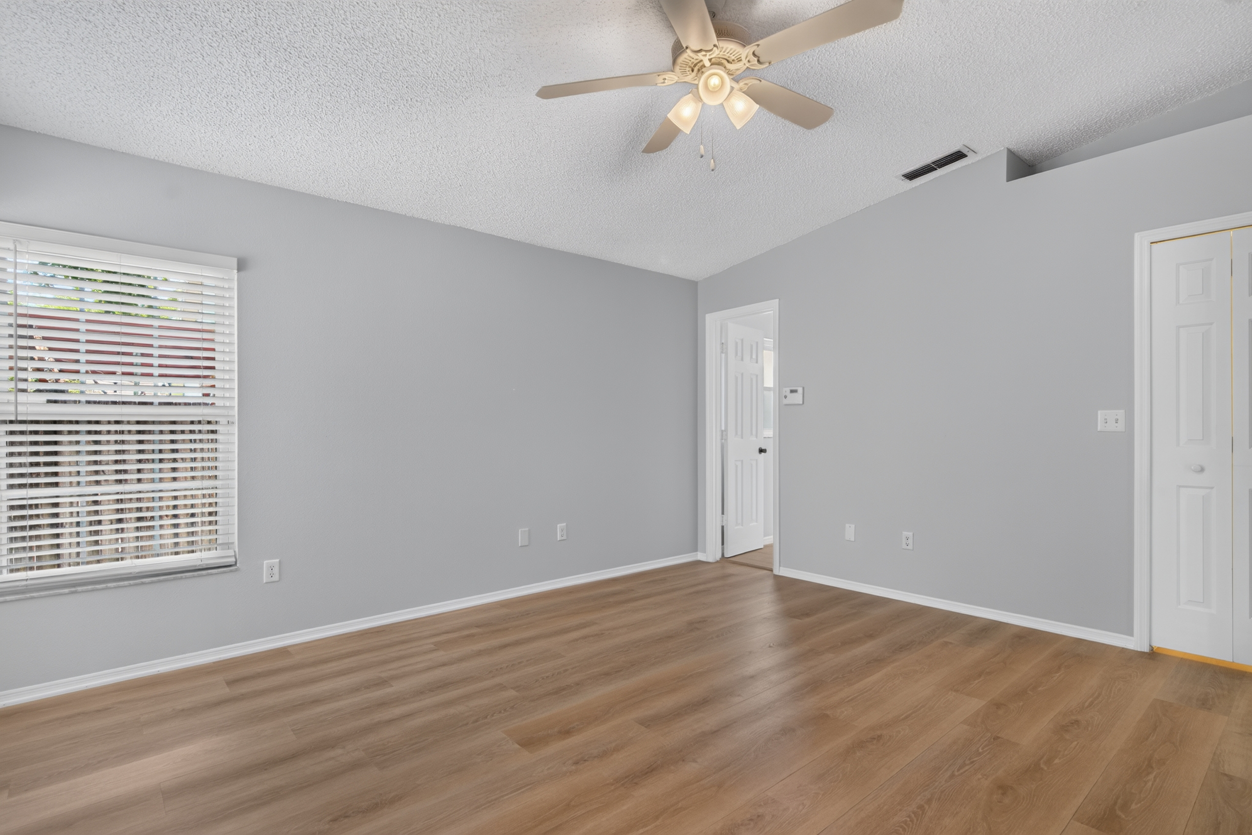 Secondary bedroom with ceiling fan at 1053 Sugarberry Trail