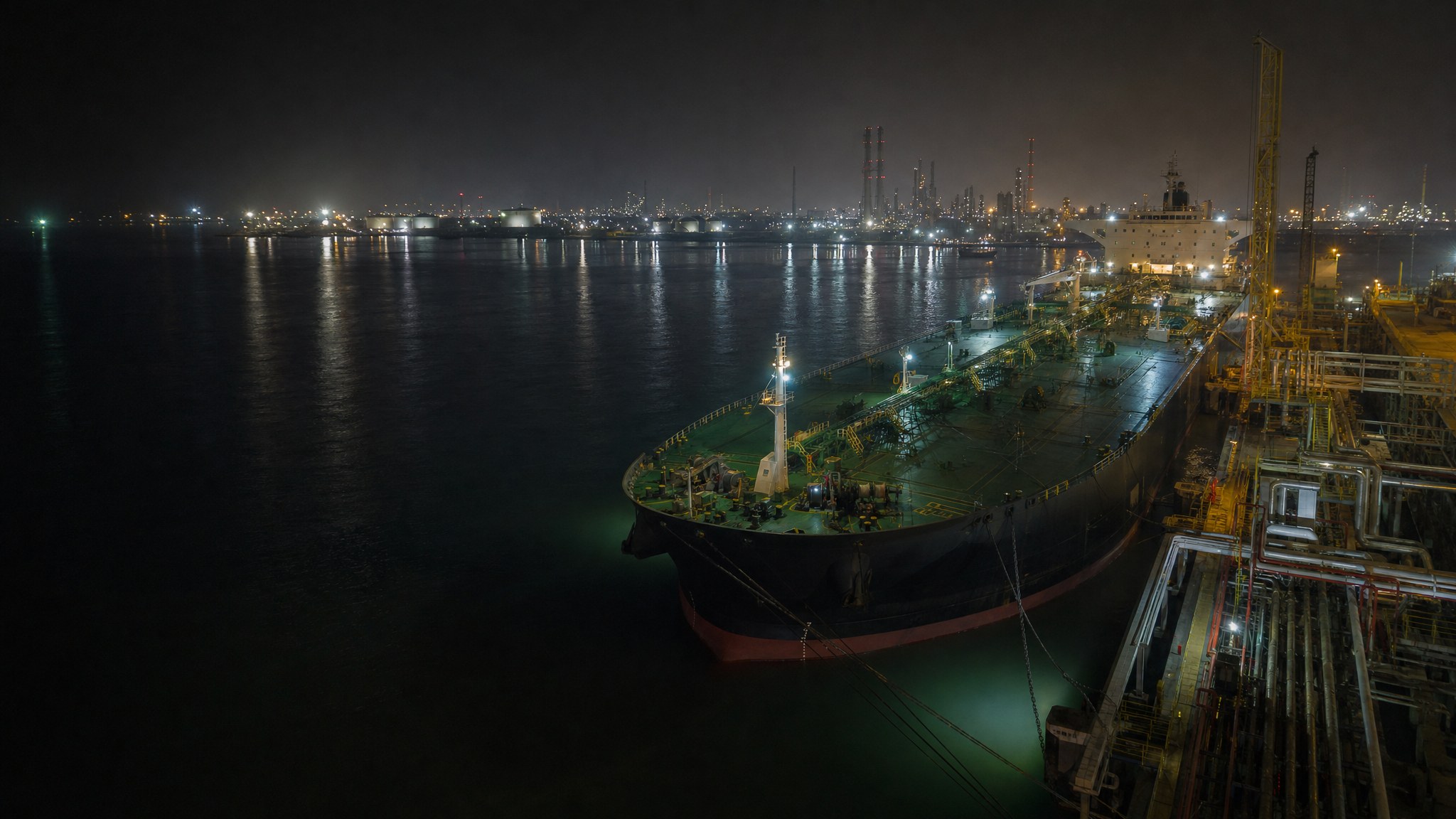 Fuel tanker at a coastal port at night