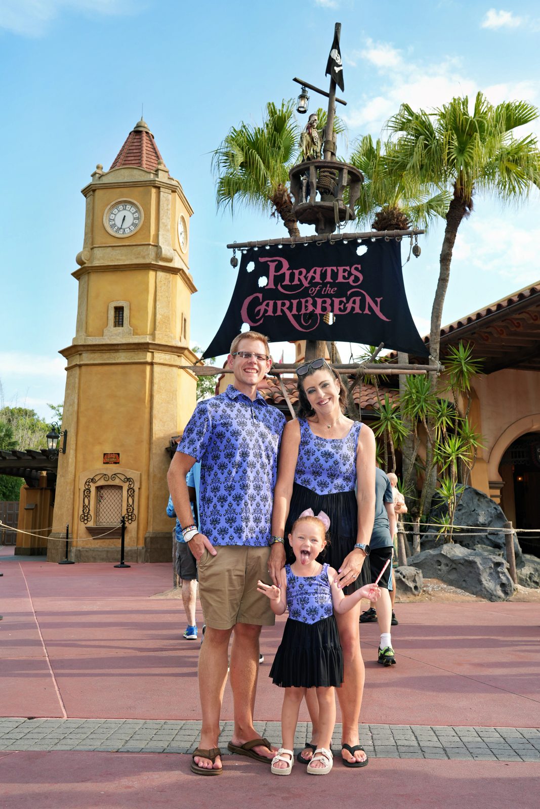 Brieanna, Londyn, and family wearing coordinating purple prints on a park day