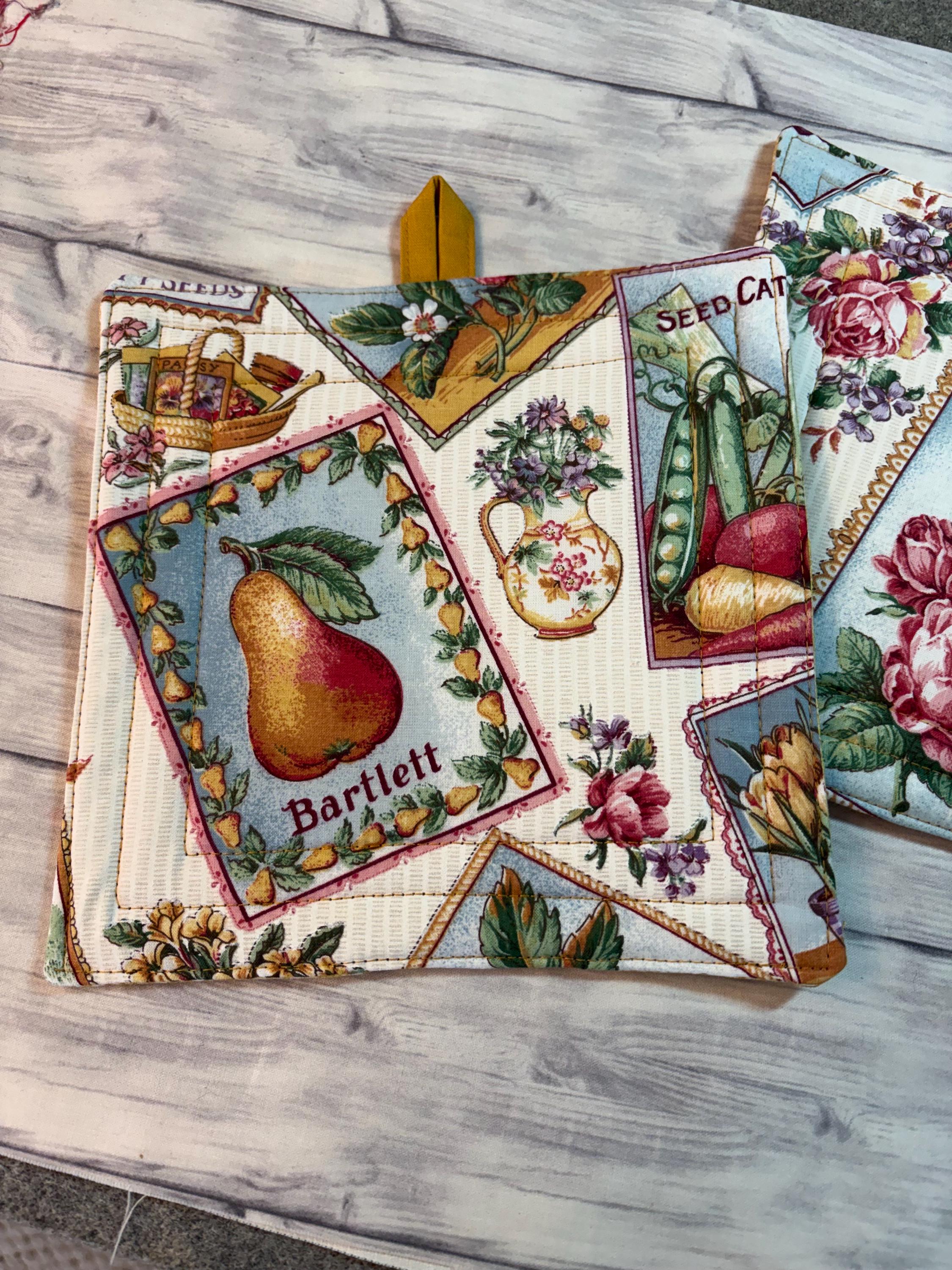 Pair of Vintage style seed pack label potholders, 8.25” homemade quilted