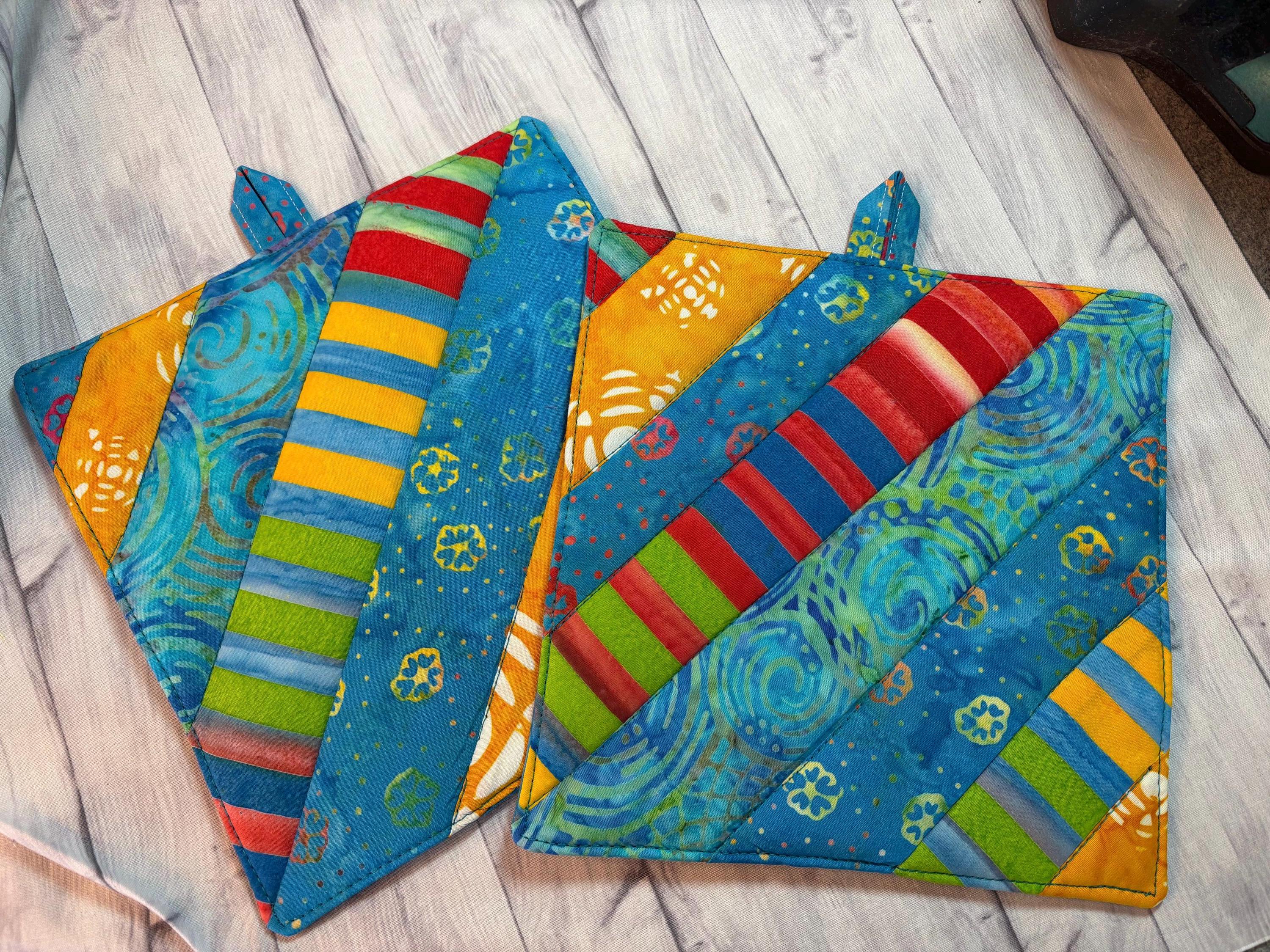 Pair of Rainbow Batik potholders, 8” homemade quilted