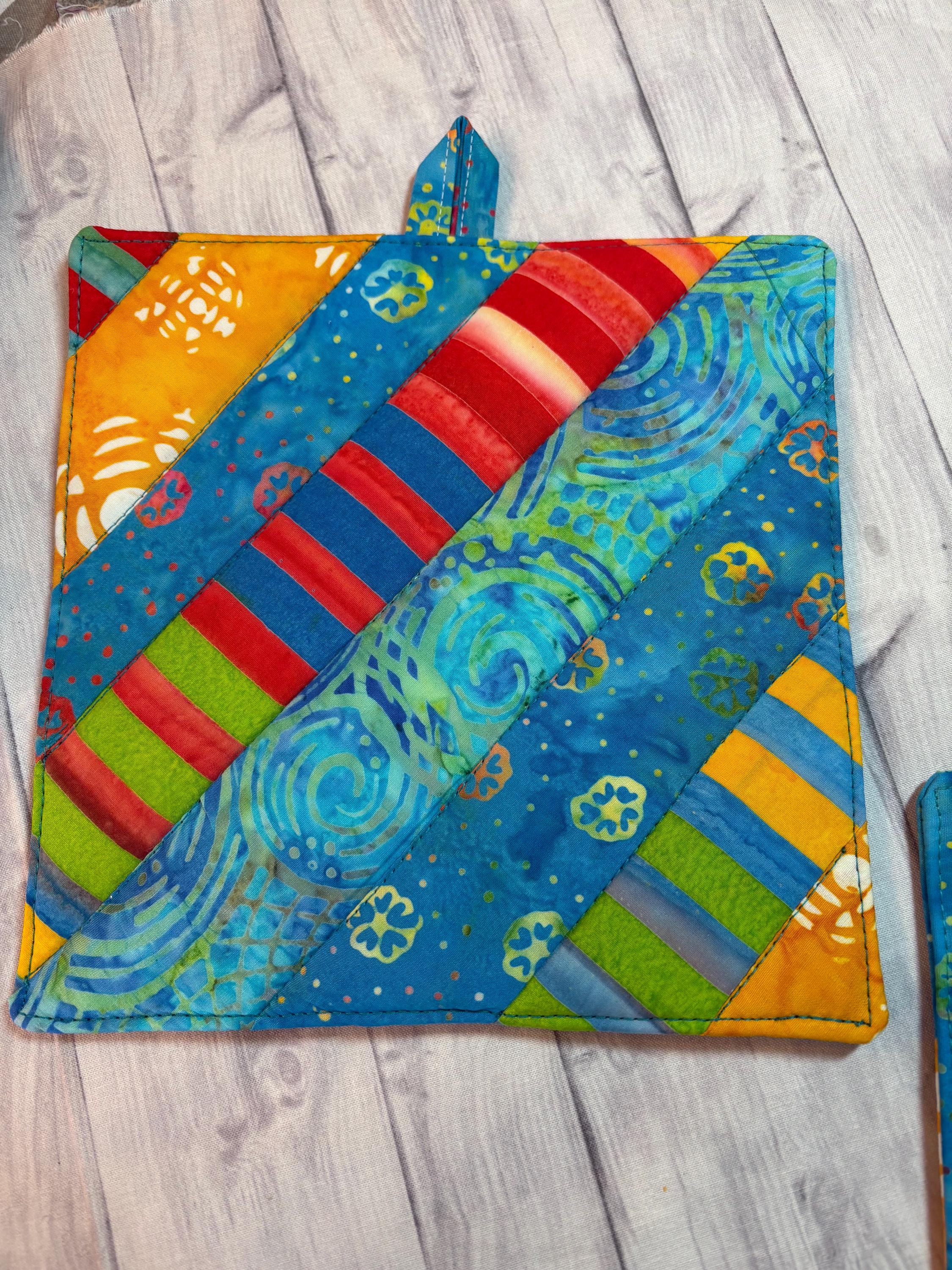 Pair of Rainbow Batik potholders, 8” homemade quilted view 4