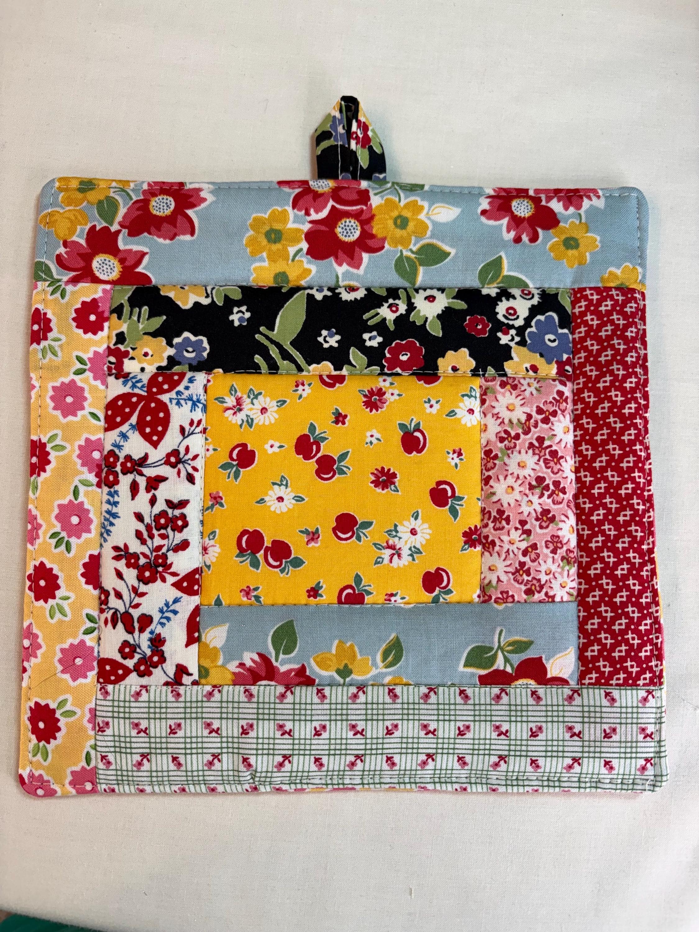 Single scrappy 30’s repro potholder, 8.25” homemade quilted