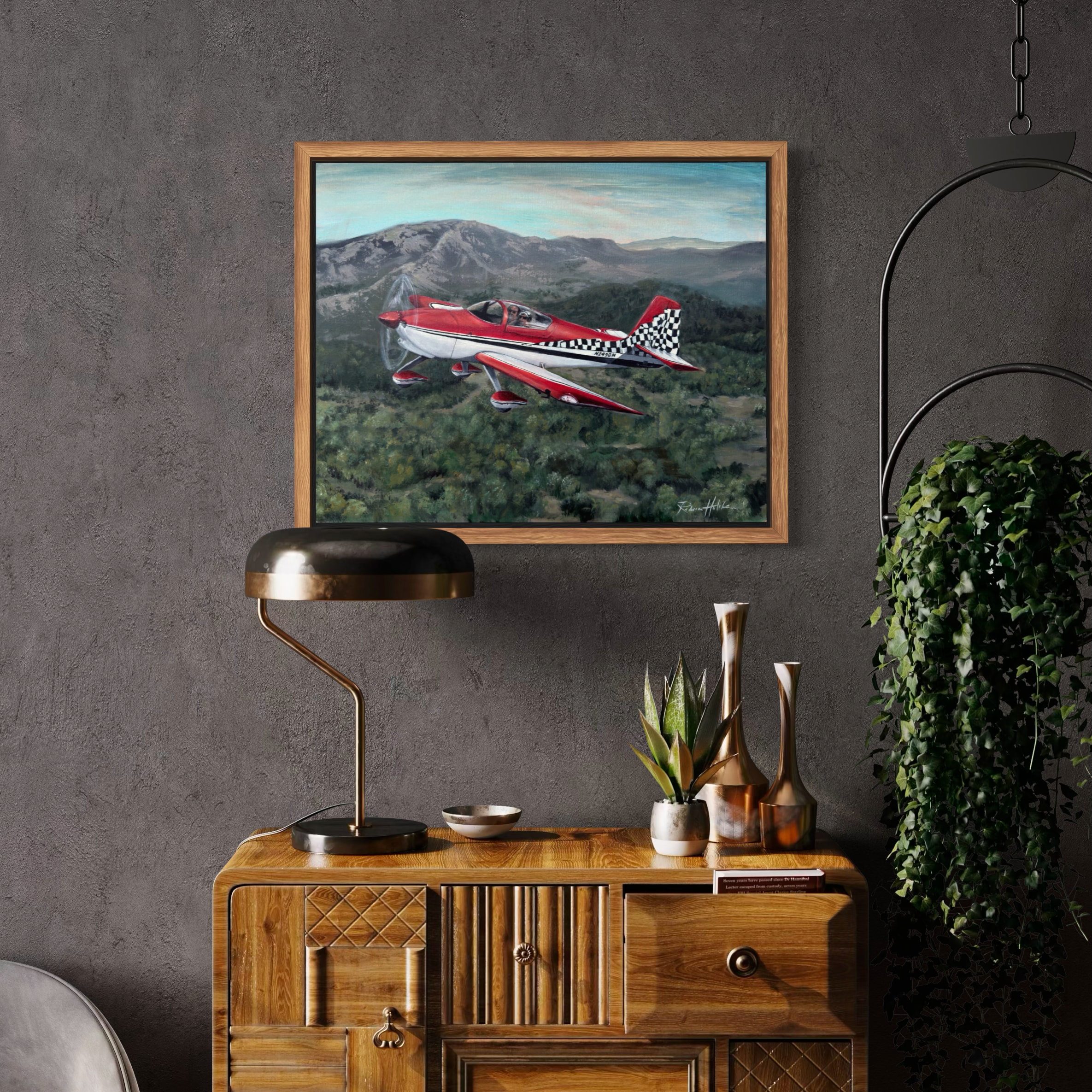 A finished red airplane painting shown in a room