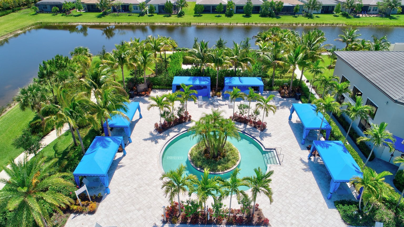 Pool deck and palm trees at a South Florida active-adult community
