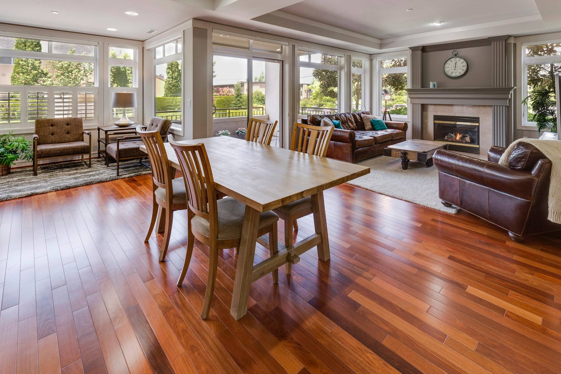 Condominium living and dining room with large windows and shared interior space
