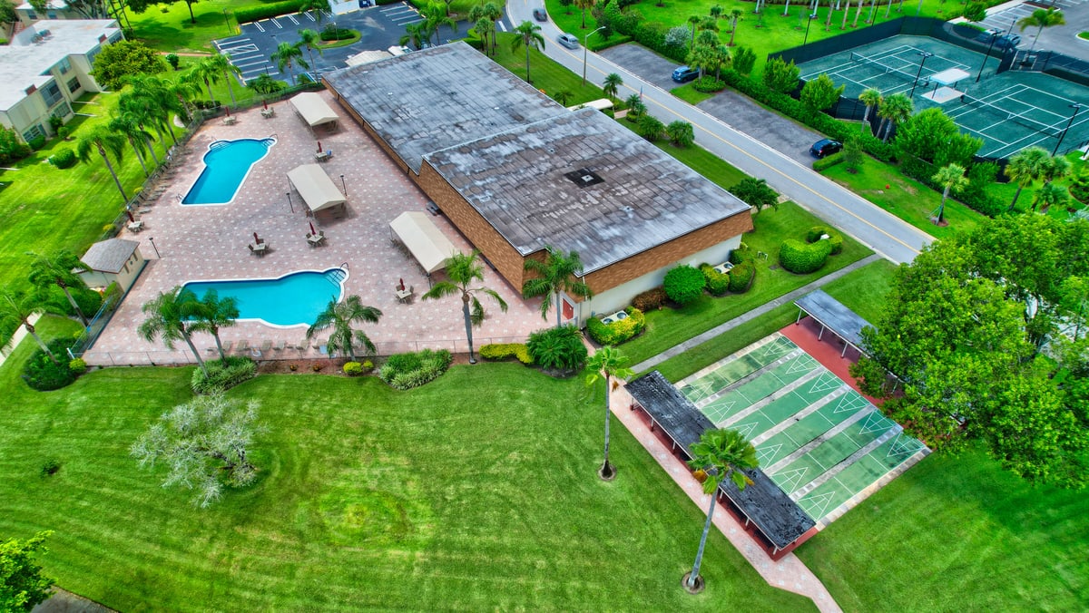 Aerial view of Abbey Village pools and shuffleboard courts