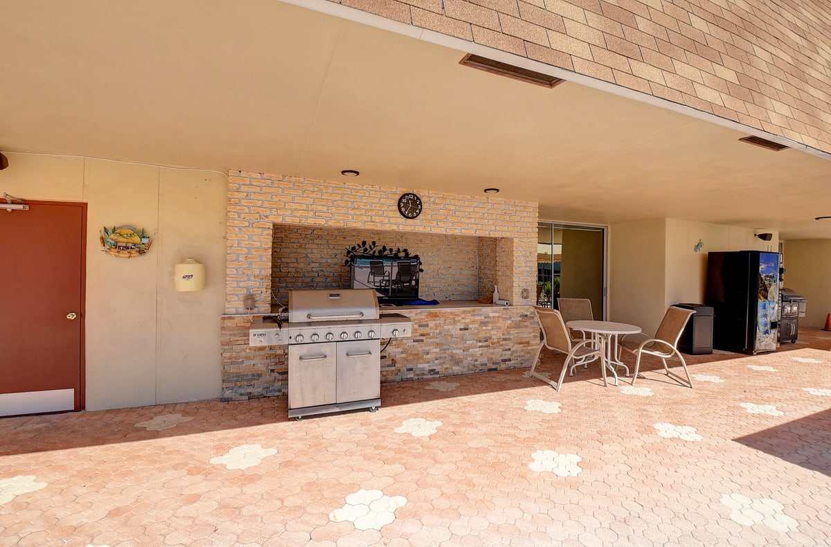 Abbey Village covered outdoor barbecue and seating area