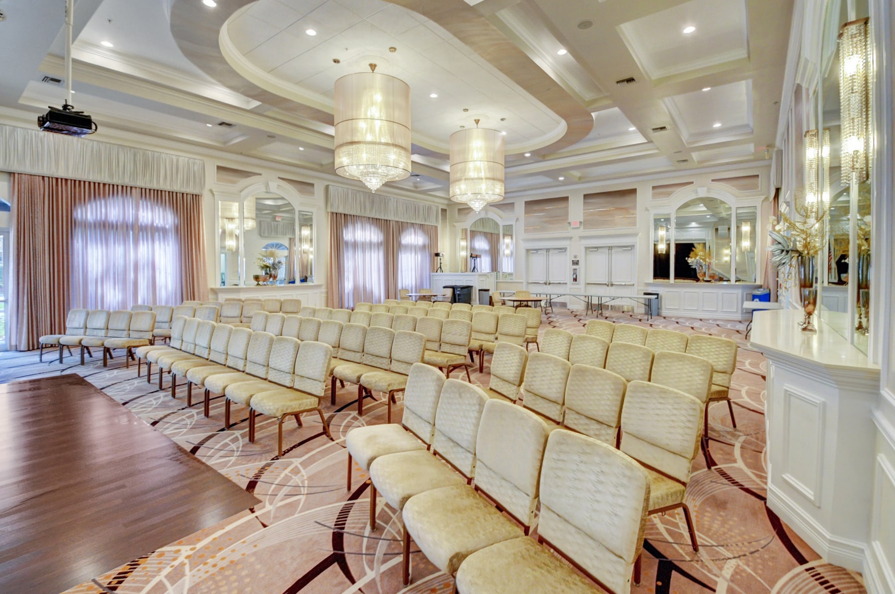 Avalon Estates clubhouse ballroom with seating and chandeliers