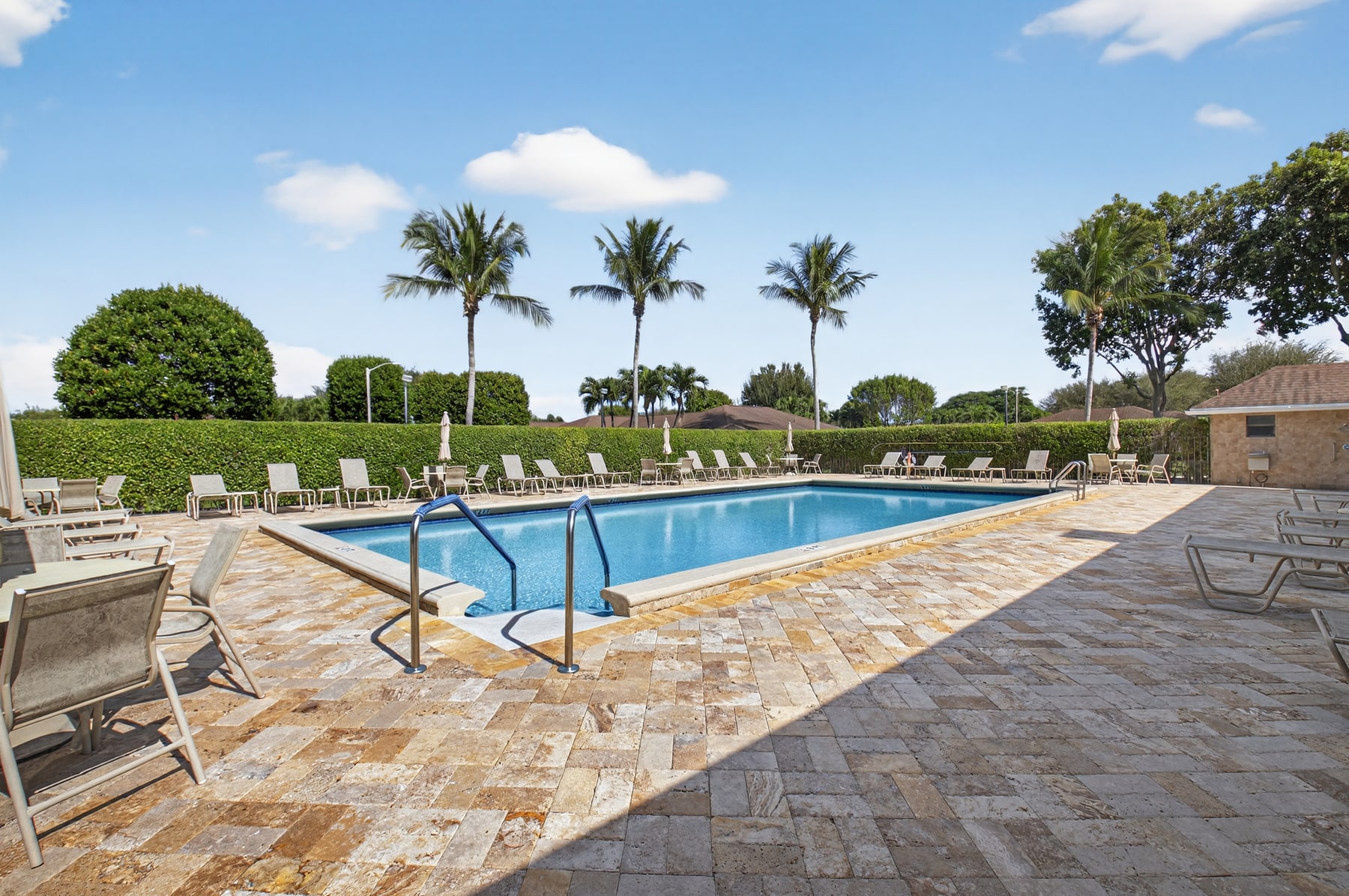 Outdoor pool and lounge area at Bent Tree Villas East