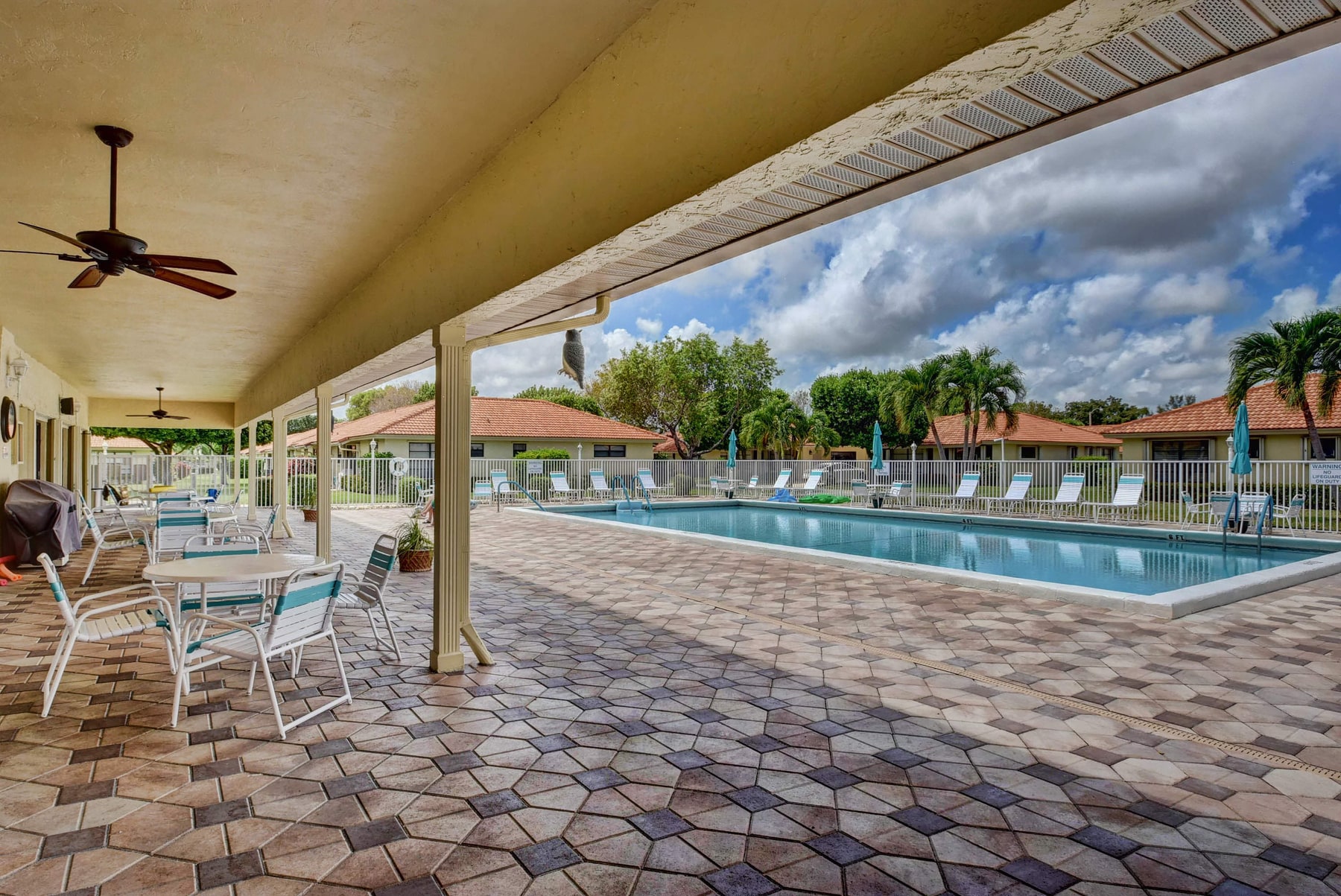 Pool patio and clubhouse at Bent Tree Villas West