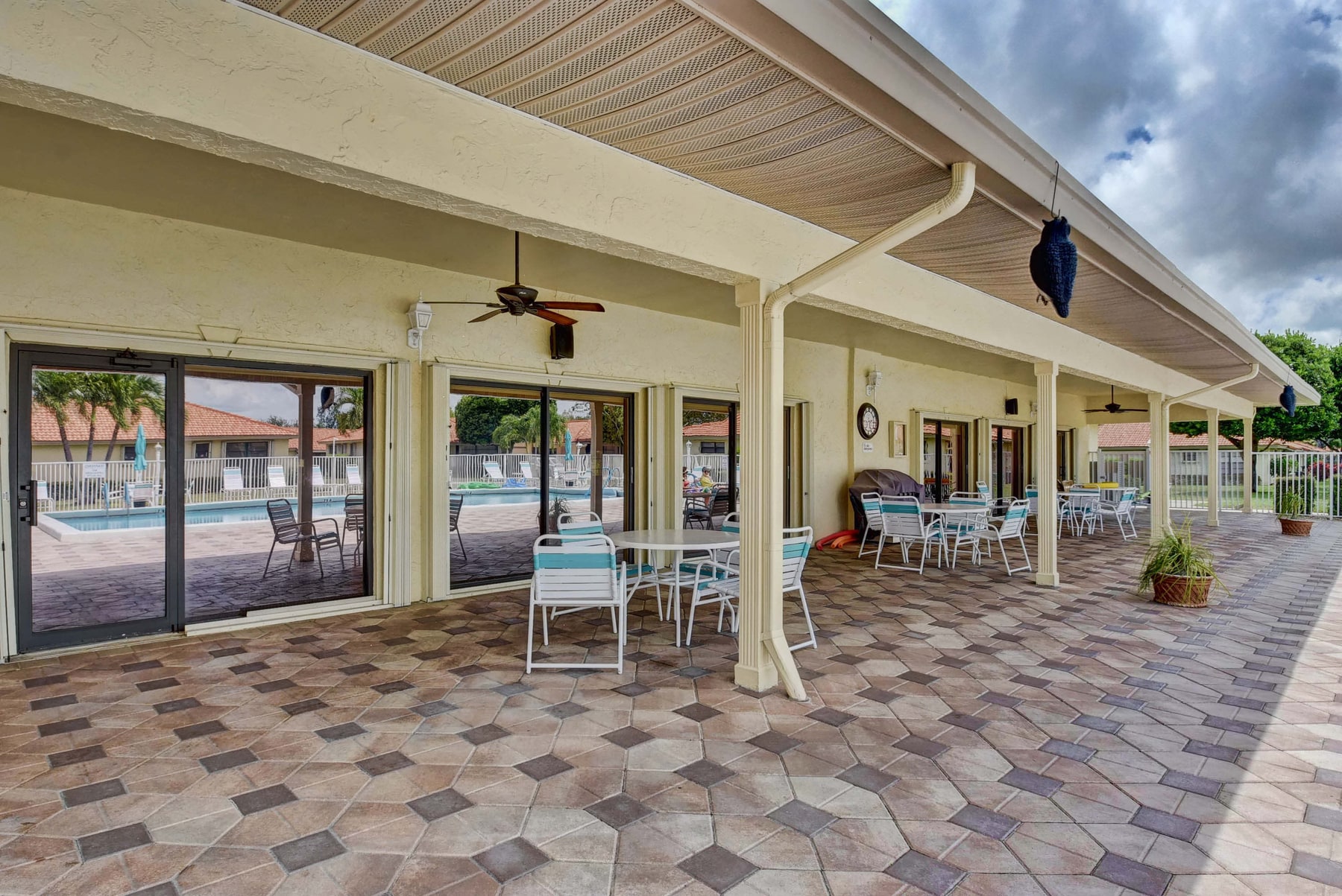 Covered poolside terrace at Bent Tree Villas West