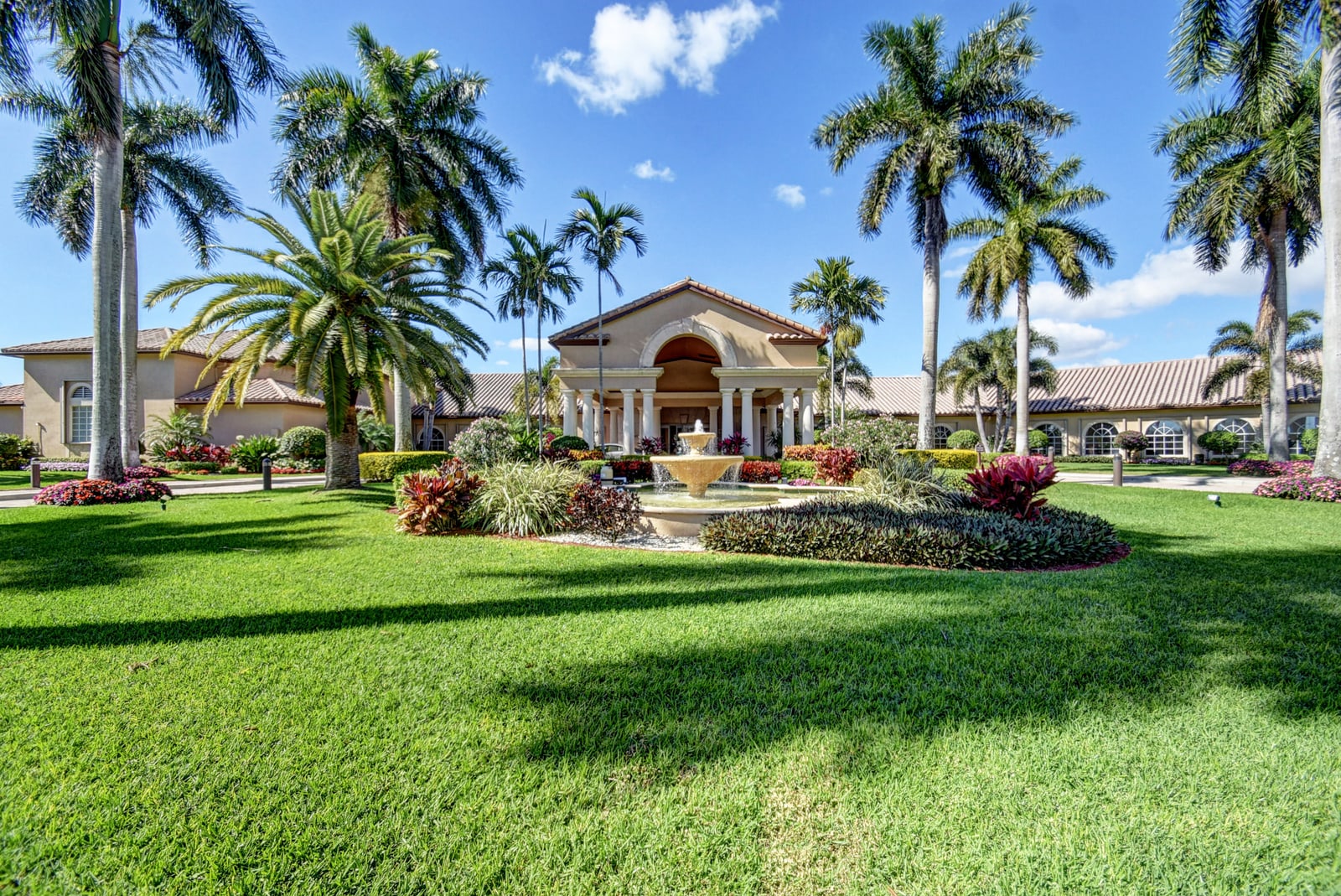 Palm-lined entrance to The Cascades in Boynton Beach