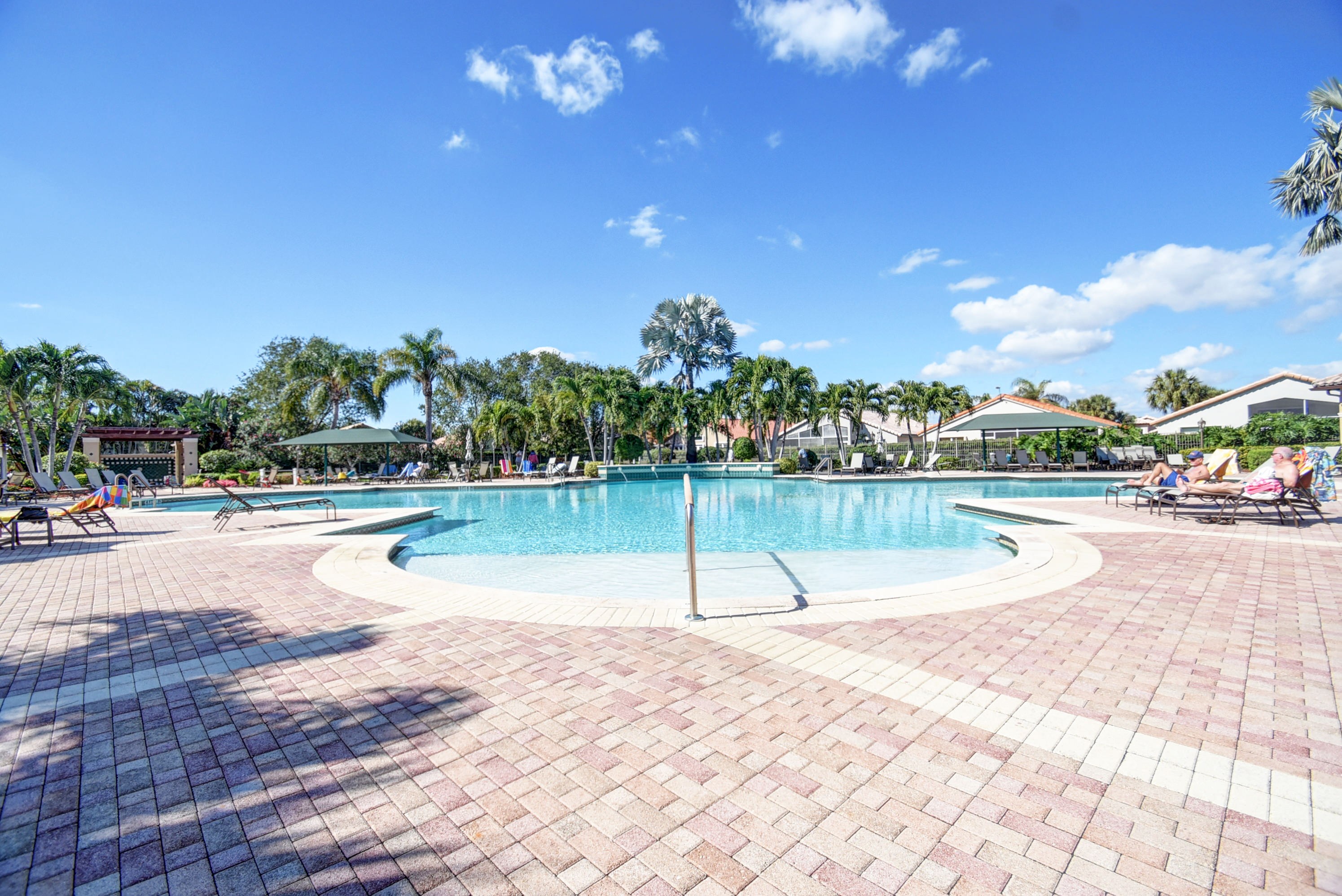 Pool deck at The Cascades active-adult community in Boynton Beach