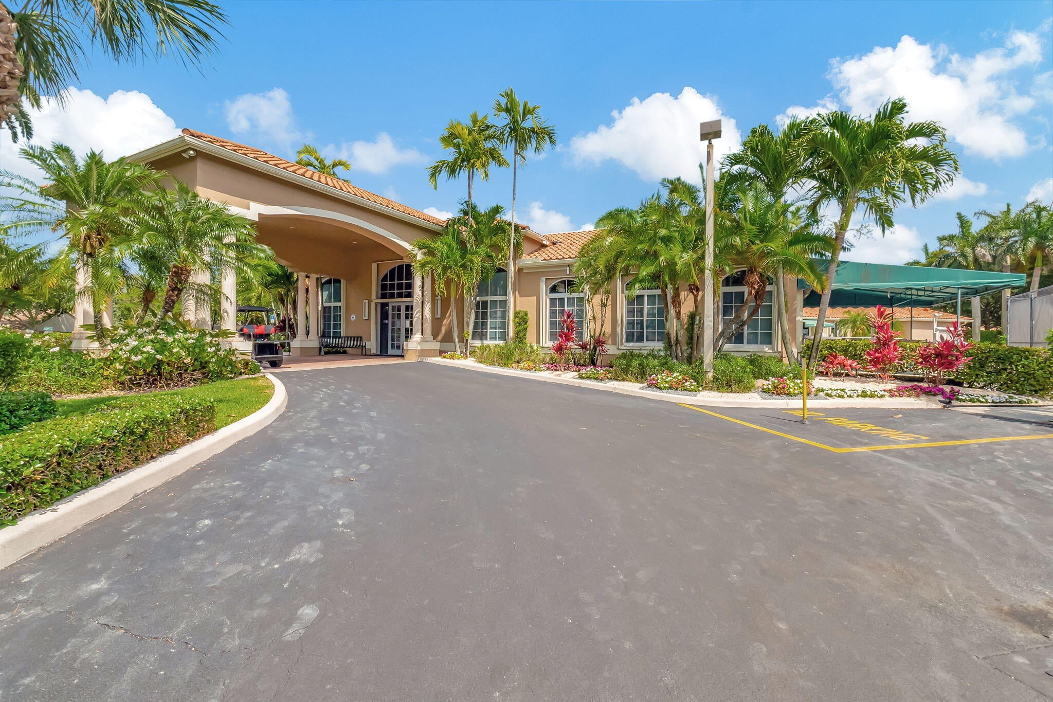 Palm-lined arrival at The Club at Indian Lakes clubhouse